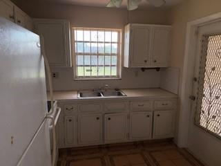 5300 Washington Street, Unit C213 Hollywood, FL 33021 - Photo 10 of 15 a kitchen with sink window and cabinets