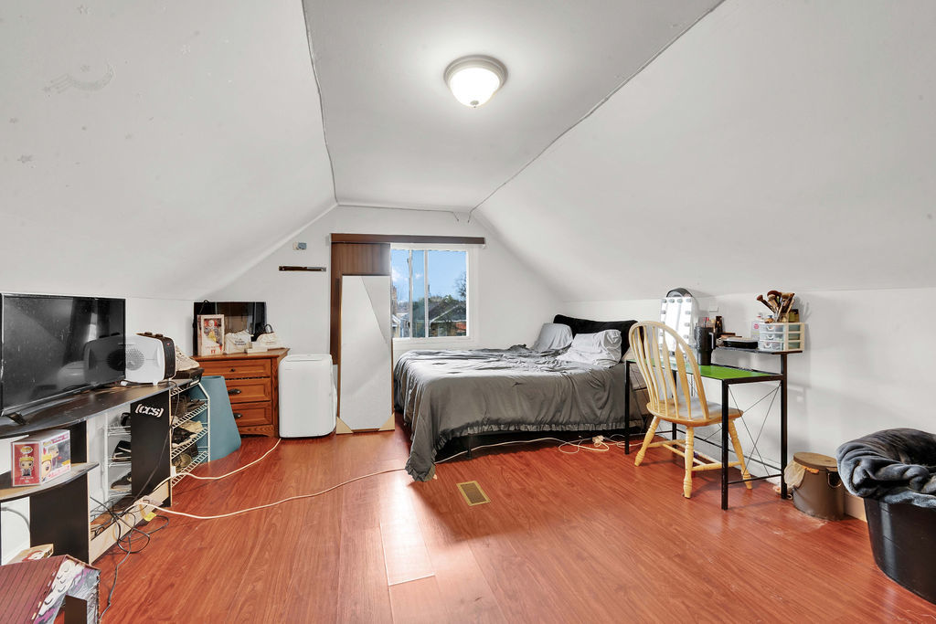 7234 South Ridgeway Avenue Chicago, IL 60629 - Photo 14 of 27 a bedroom with furniture and a flat screen tv