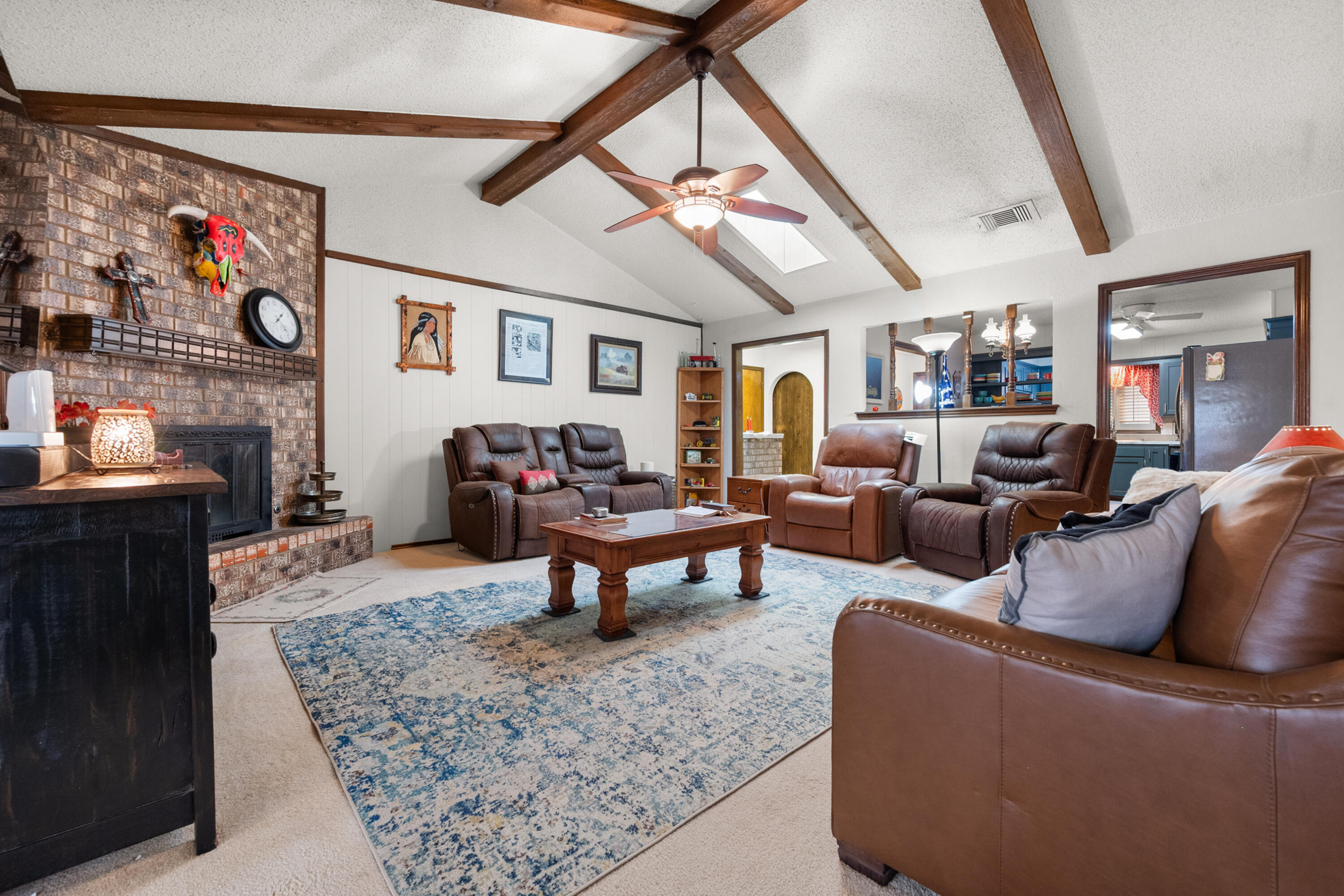 4610 63rd Street Lubbock, TX 79414 - Photo 11 of 30 a living room with furniture and a fireplace