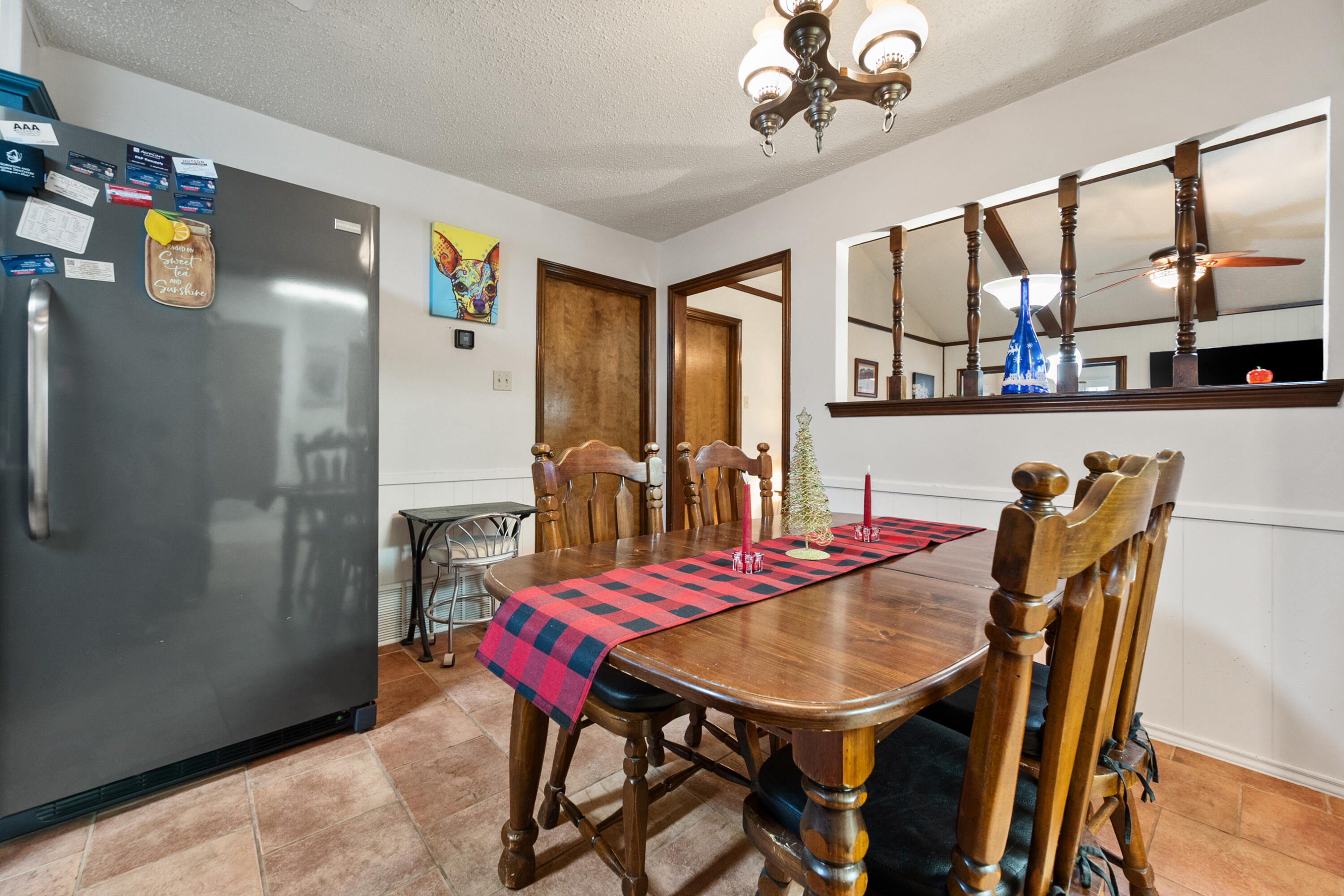 4610 63rd Street Lubbock, TX 79414 - Photo 12 of 30 a view of a dining room with furniture and chandelier