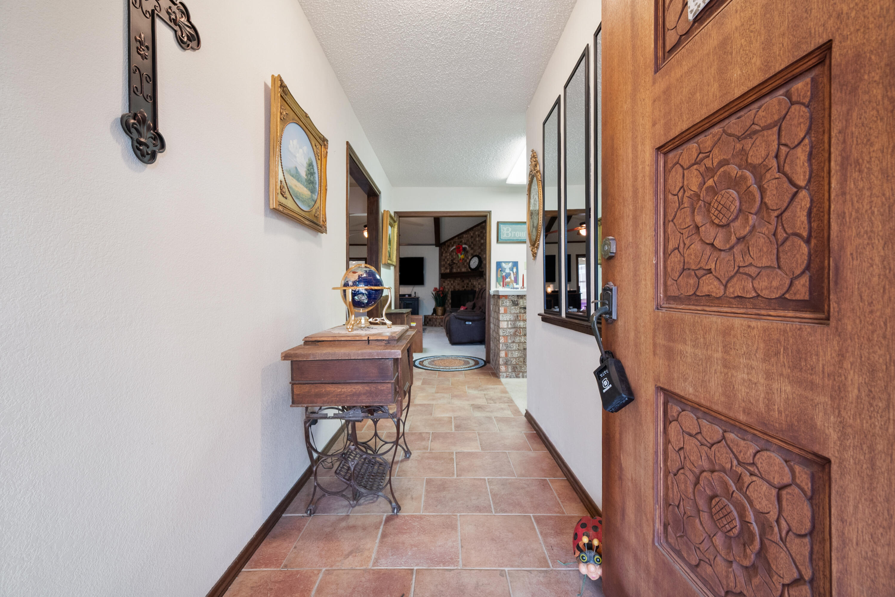 4610 63rd Street Lubbock, TX 79414 - Photo 5 of 30 a hallway with a table and chairs