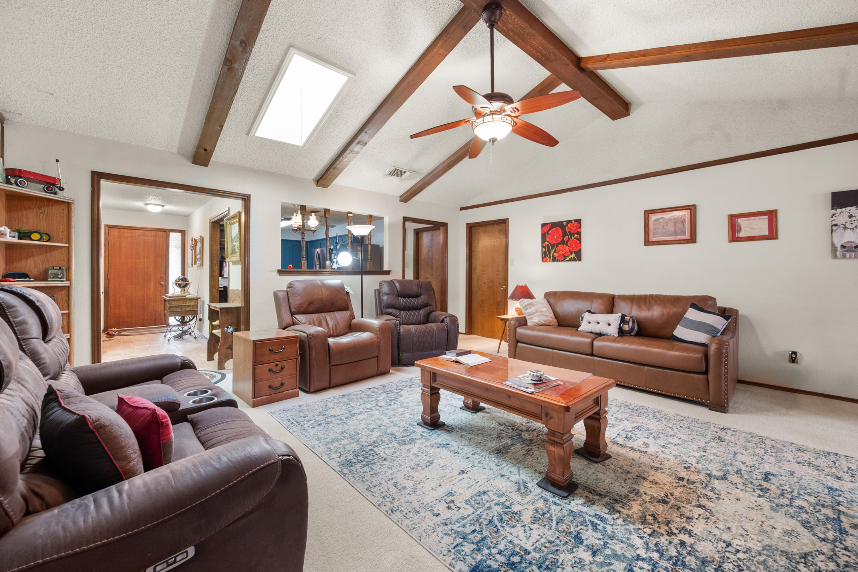 4610 63rd Street Lubbock, TX 79414 - Photo 10 of 30 a living room with furniture and a ceiling fan