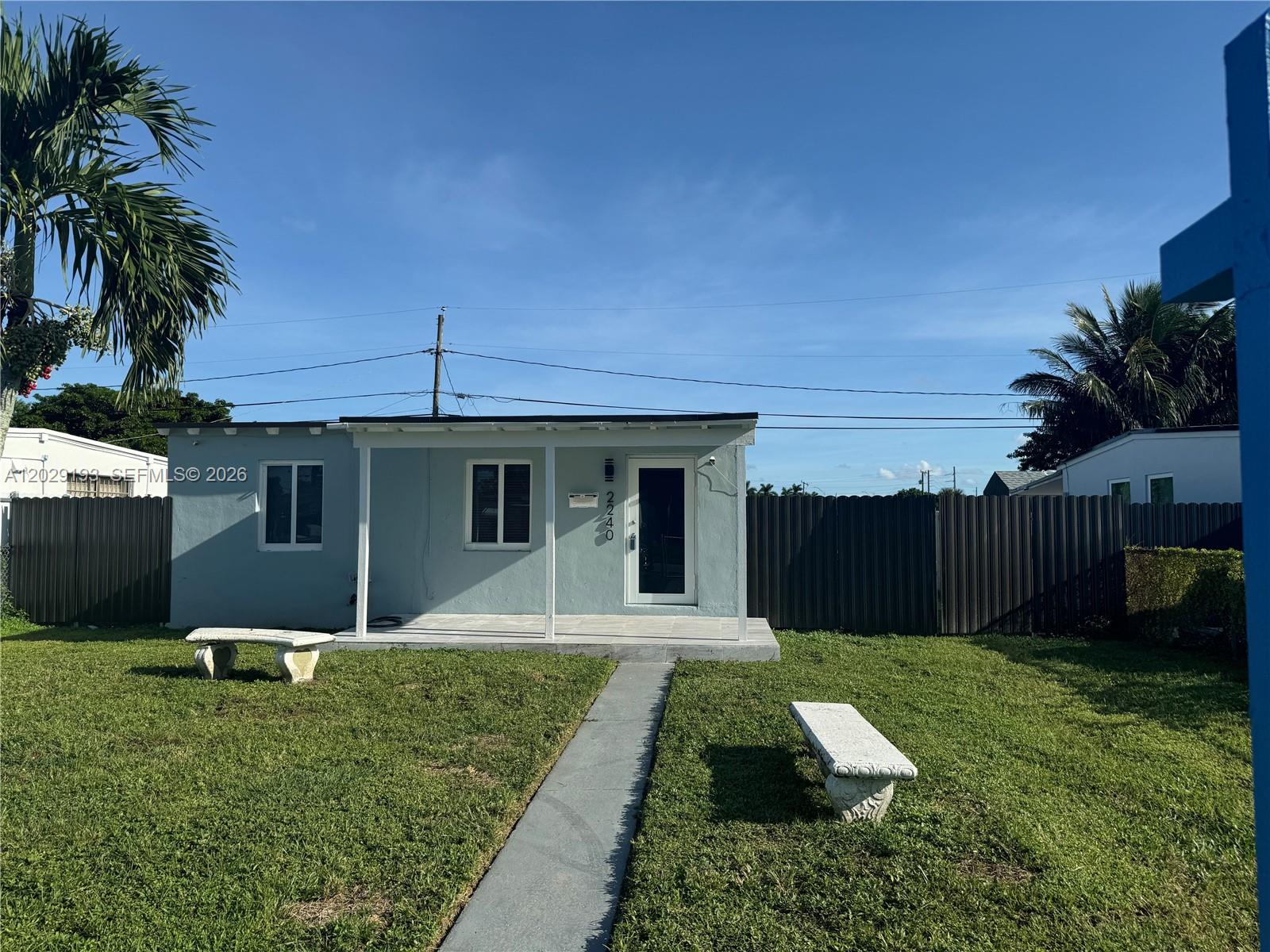 2240 Rutland Street Opa-Locka, FL 33054 - Photo 8 of 11 a front view of house with yard