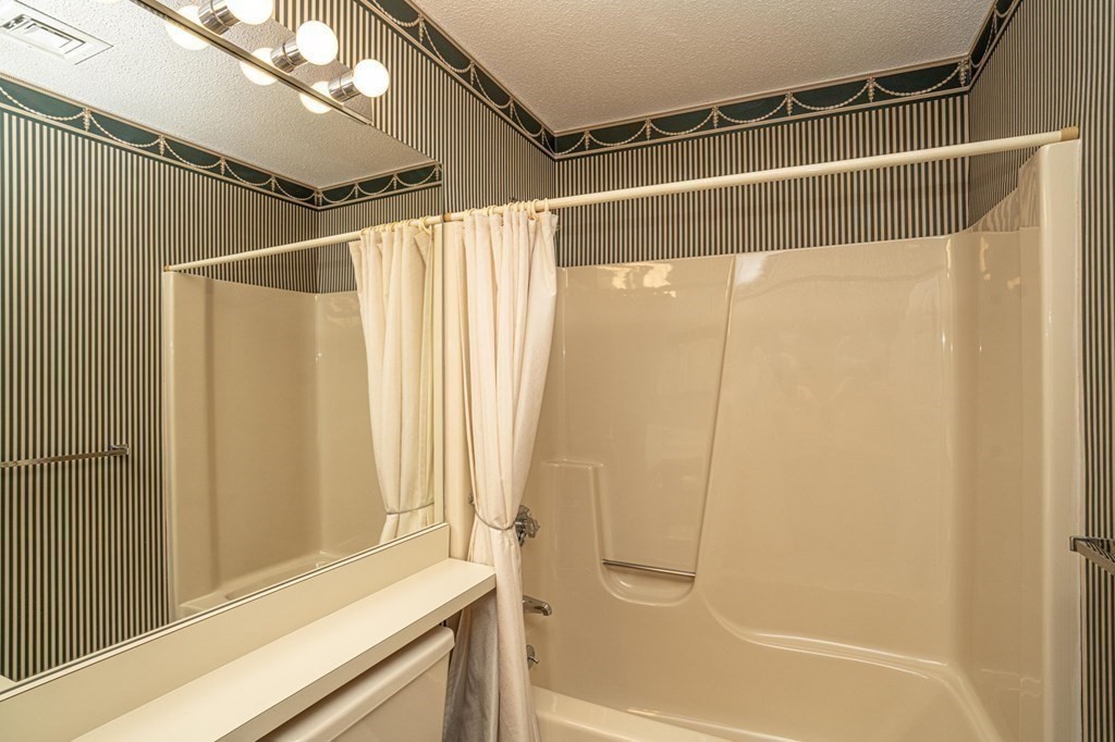 700 Shore Drive, Unit 511 Fall River, MA 02721 - Photo 15 of 40 a bathroom with a shower and a tub