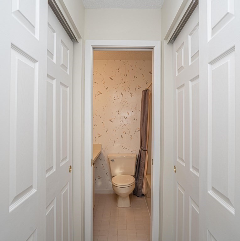 700 Shore Drive, Unit 511 Fall River, MA 02721 - Photo 18 of 40 a bathroom with a granite countertop sink toilet and shower