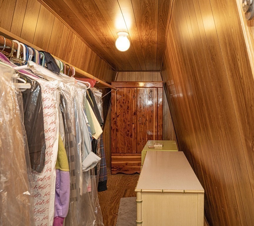 700 Shore Drive, Unit 511 Fall River, MA 02721 - Photo 28 of 40 a view of walk in closet with clothes and a door