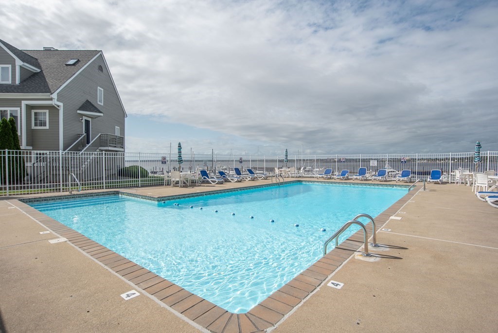 700 Shore Drive, Unit 511 Fall River, MA 02721 - Photo 40 of 40 a view of a swimming pool with a lawn chairs