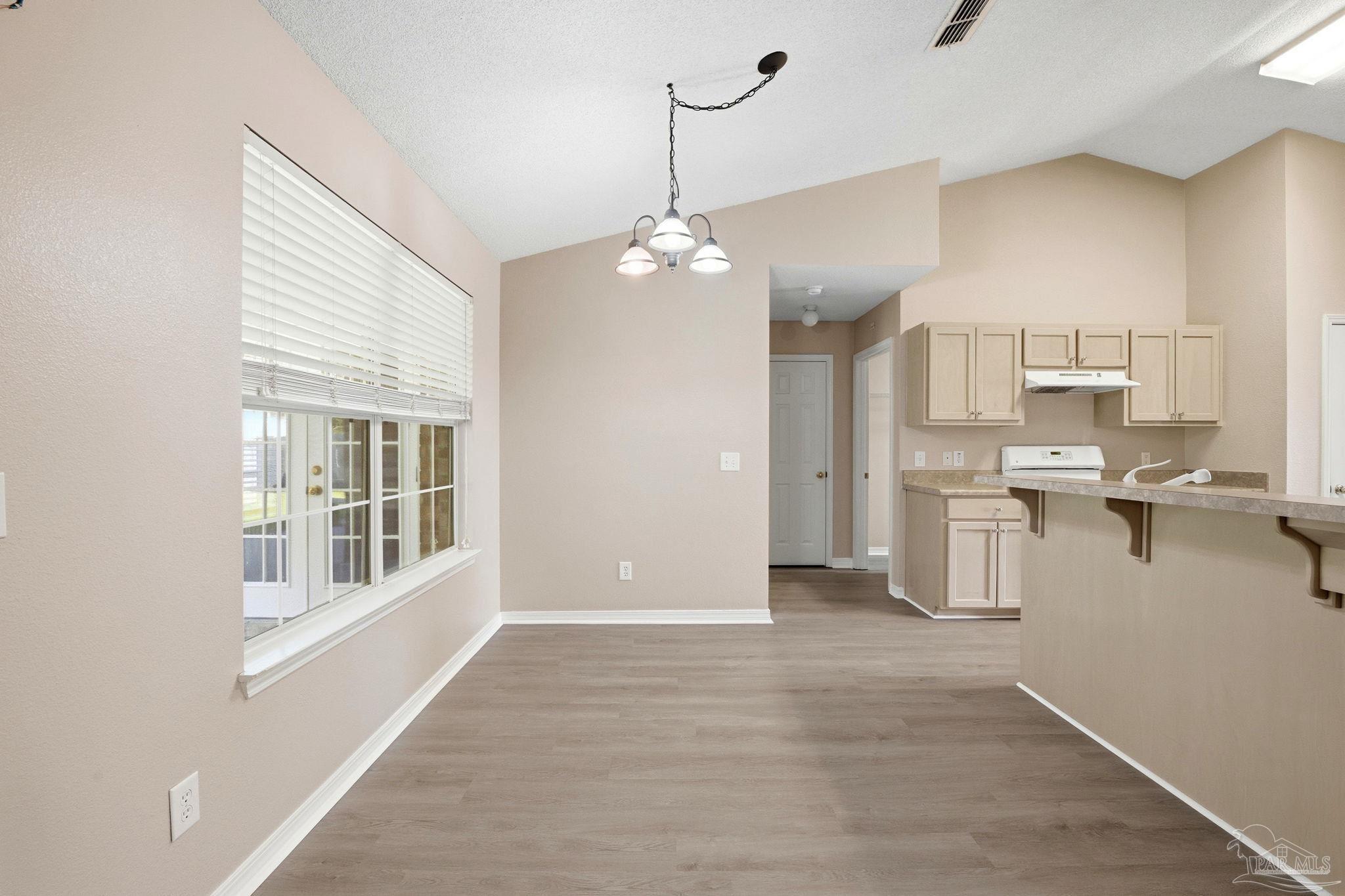 1844 Wareham Way Cantonment, FL 32533 - Photo 11 of 47 a view of a kitchen with a sink a refrigerator and window