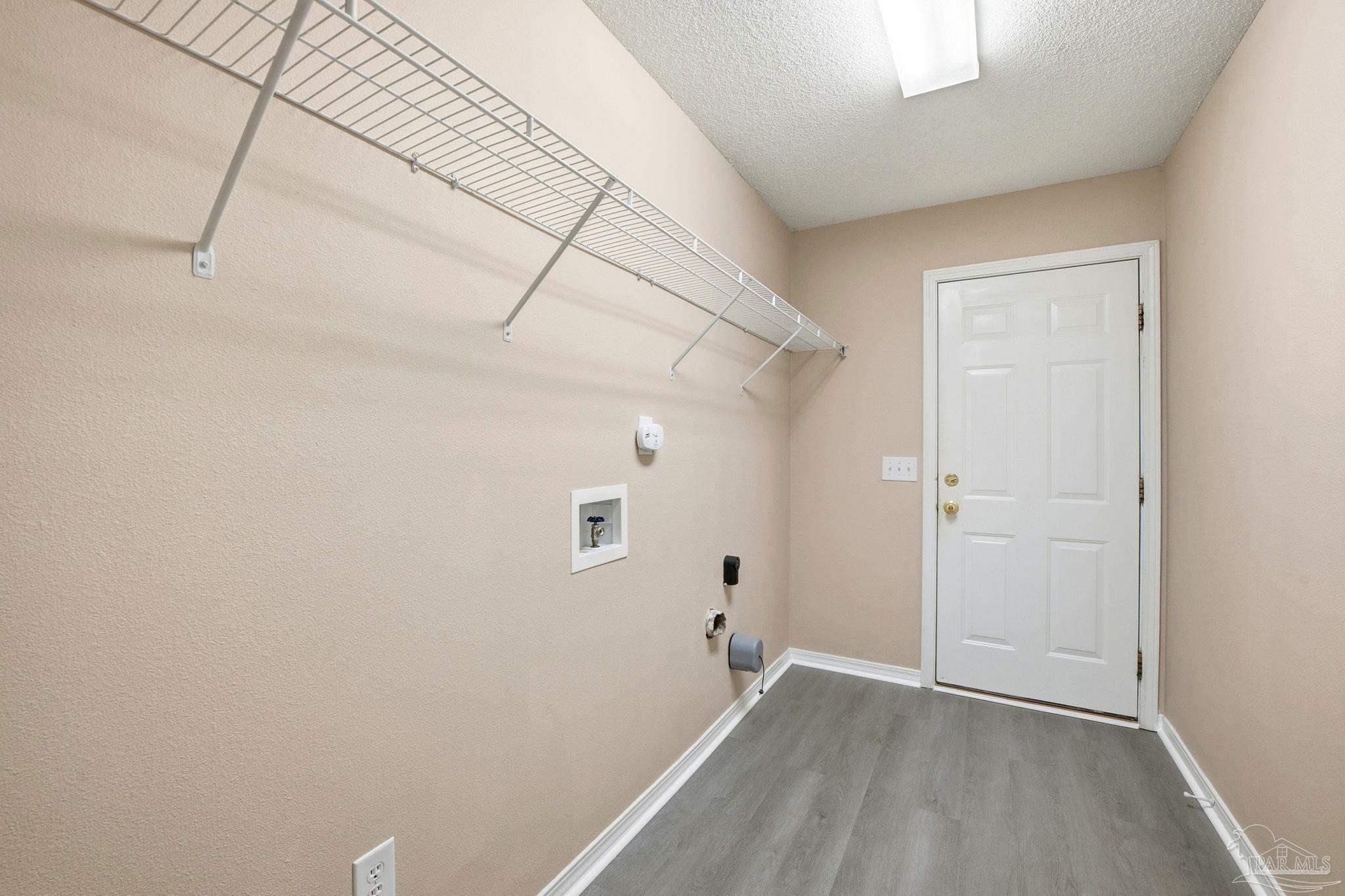 1844 Wareham Way Cantonment, FL 32533 - Photo 20 of 47 an empty room with wooden floor and windows