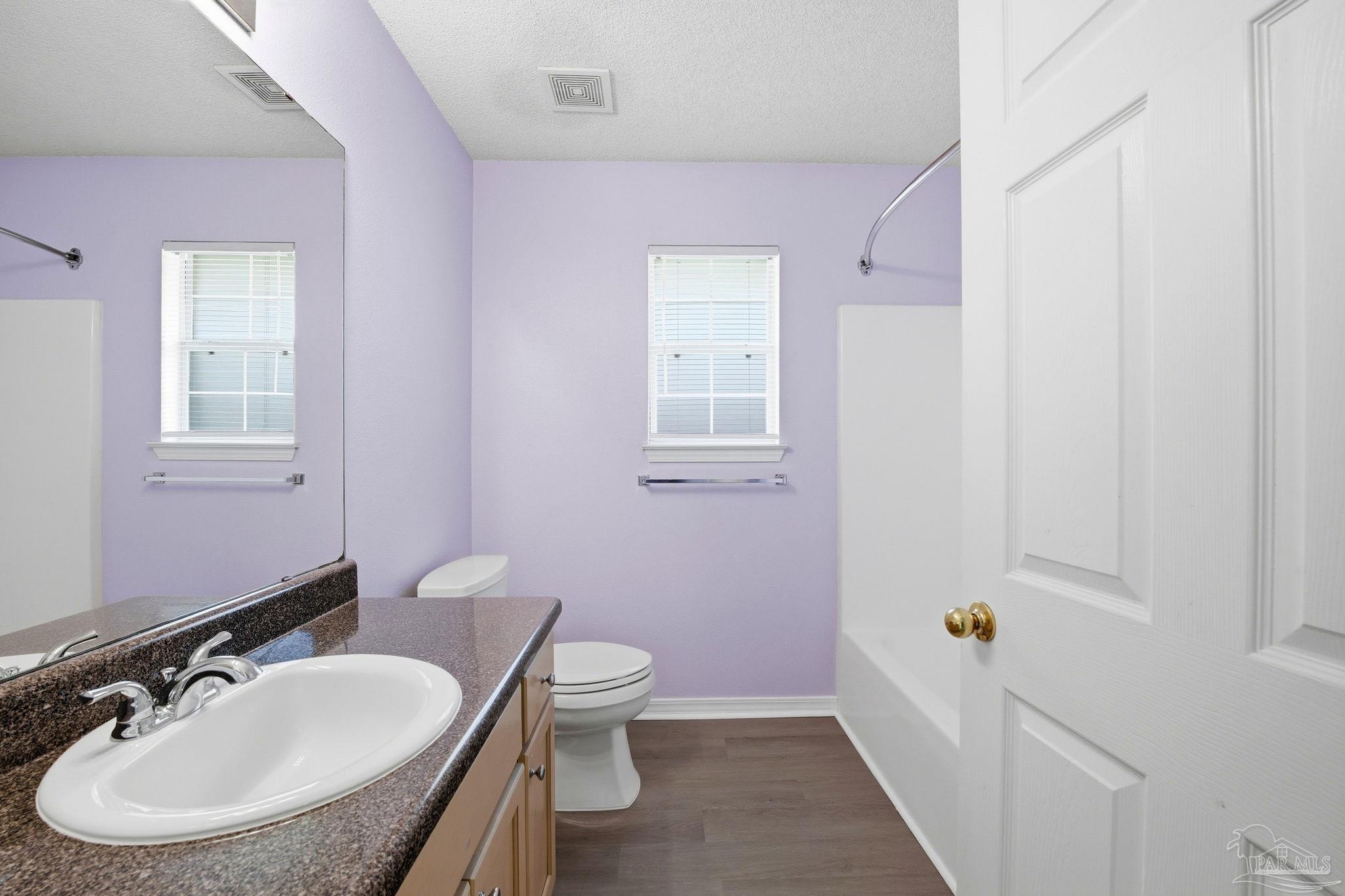 1844 Wareham Way Cantonment, FL 32533 - Photo 34 of 47 a bathroom with a sink a toilet and shower