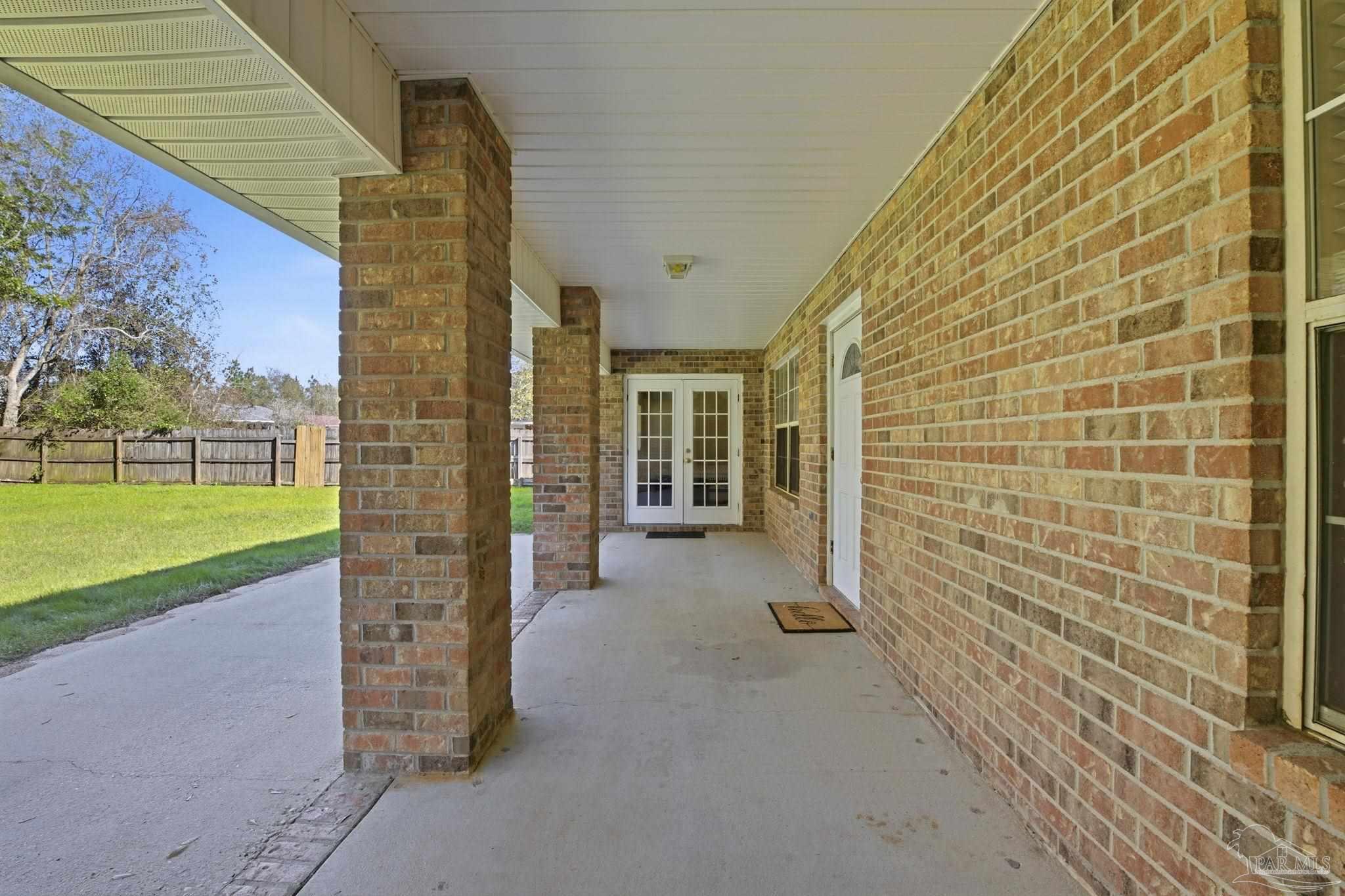 1844 Wareham Way Cantonment, FL 32533 - Photo 40 of 47 a view of a porch with wooden floor and fence