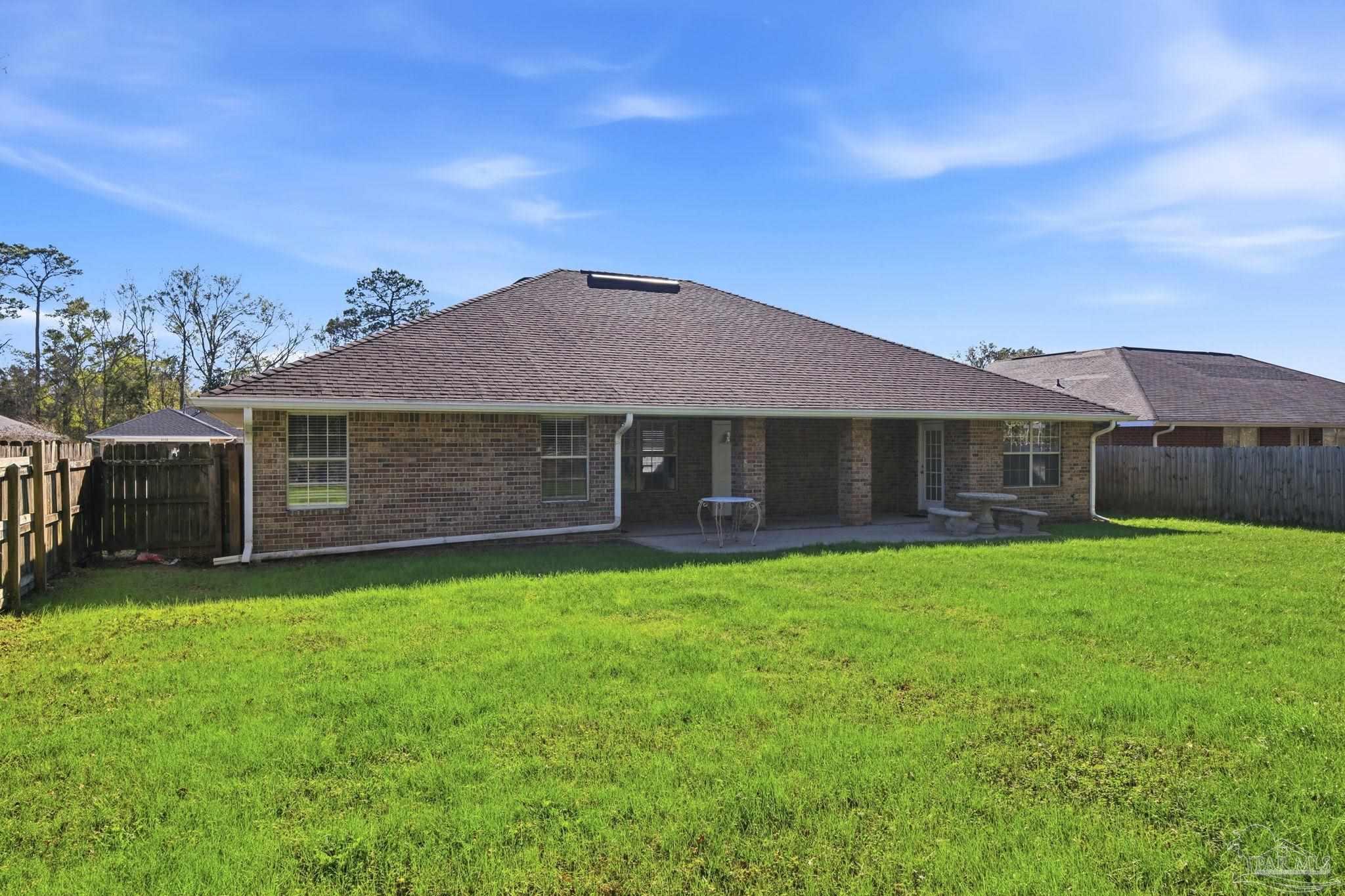 1844 Wareham Way Cantonment, FL 32533 - Photo 44 of 47 a front view of a house with a garden