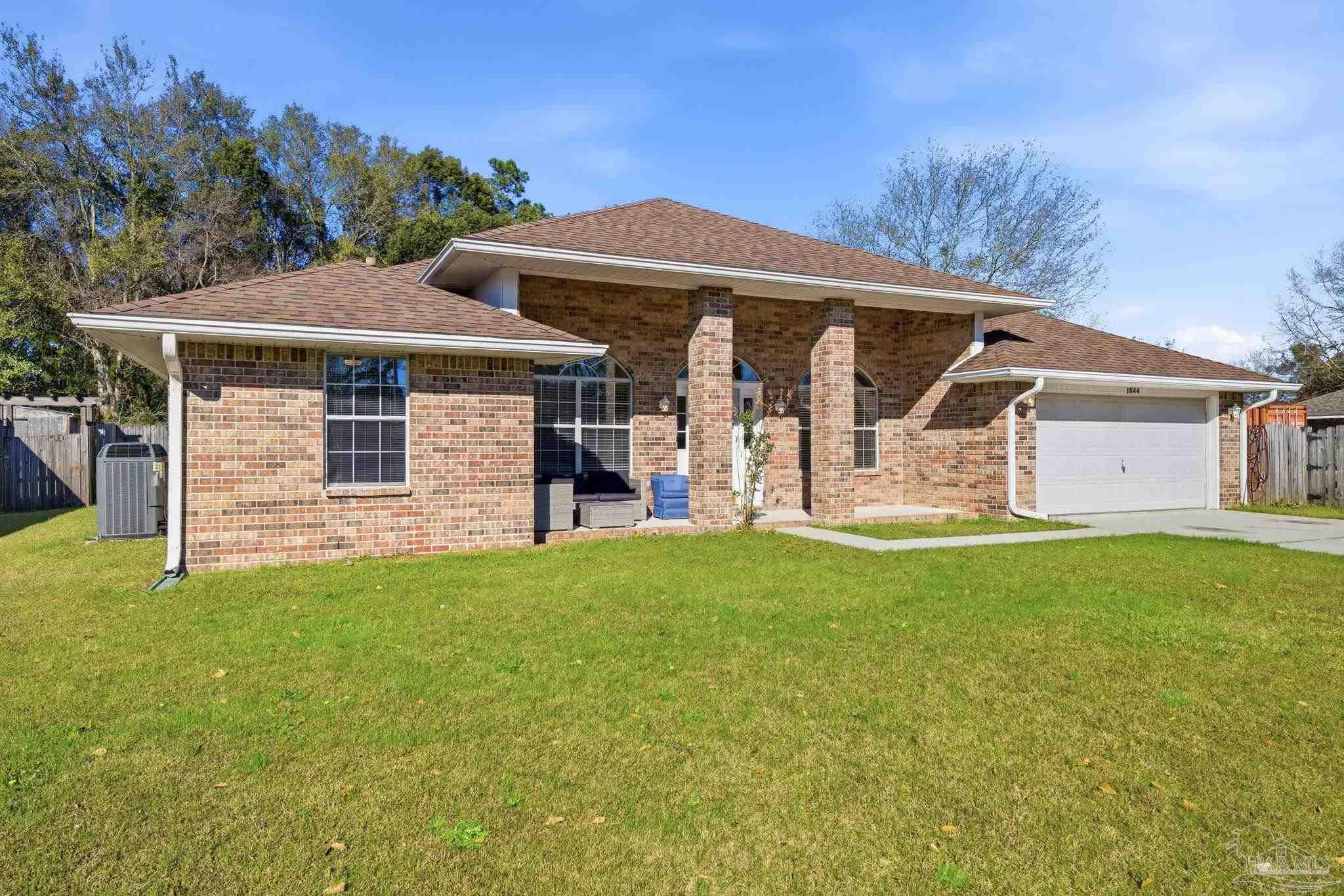 1844 Wareham Way Cantonment, FL 32533 - Photo 47 of 47 a front view of a house with a garden
