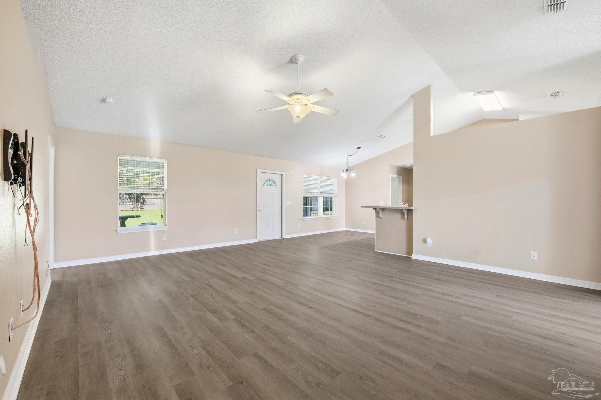 1844 Wareham Way Cantonment, FL 32533 - Photo 7 of 47 a view of empty room with wooden floor and fan