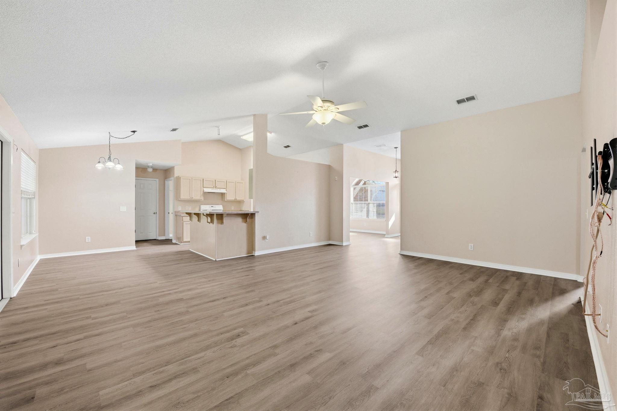1844 Wareham Way Cantonment, FL 32533 - Photo 10 of 47 a view of a kitchen with a sink and a refrigerator