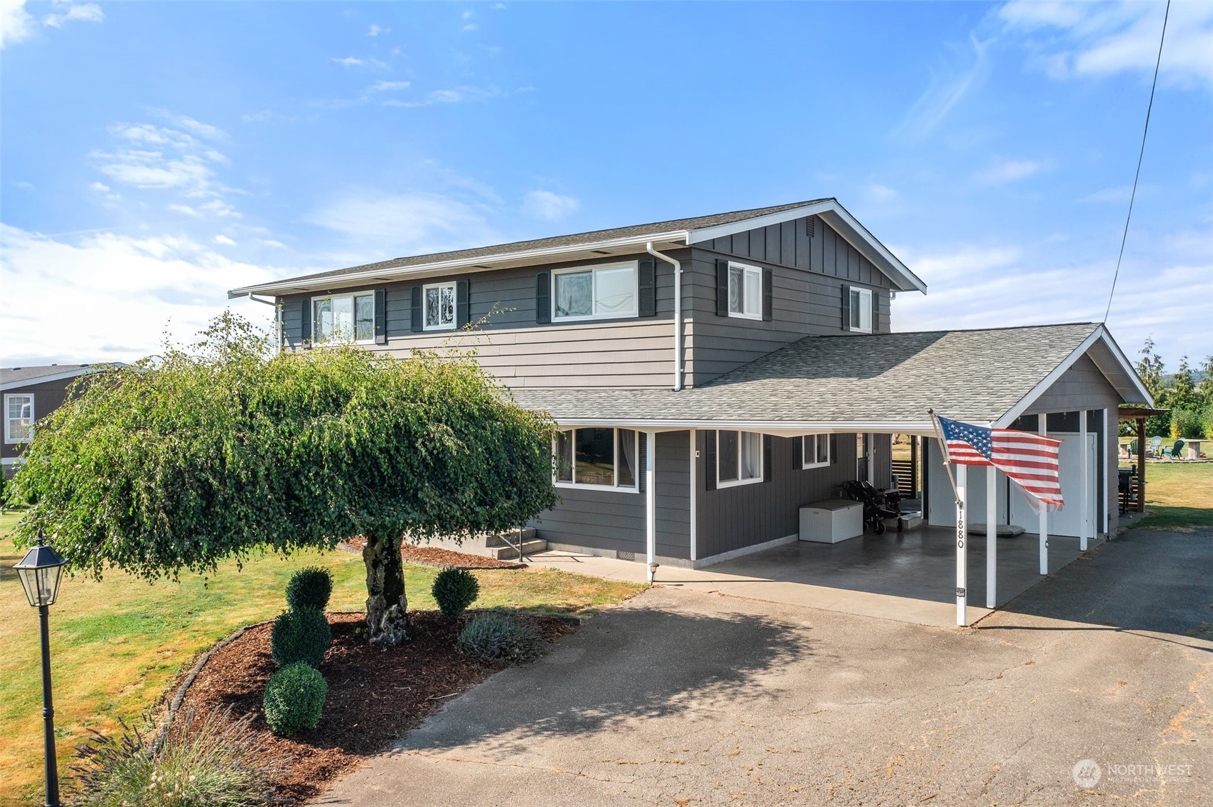 a front view of a house with a yard