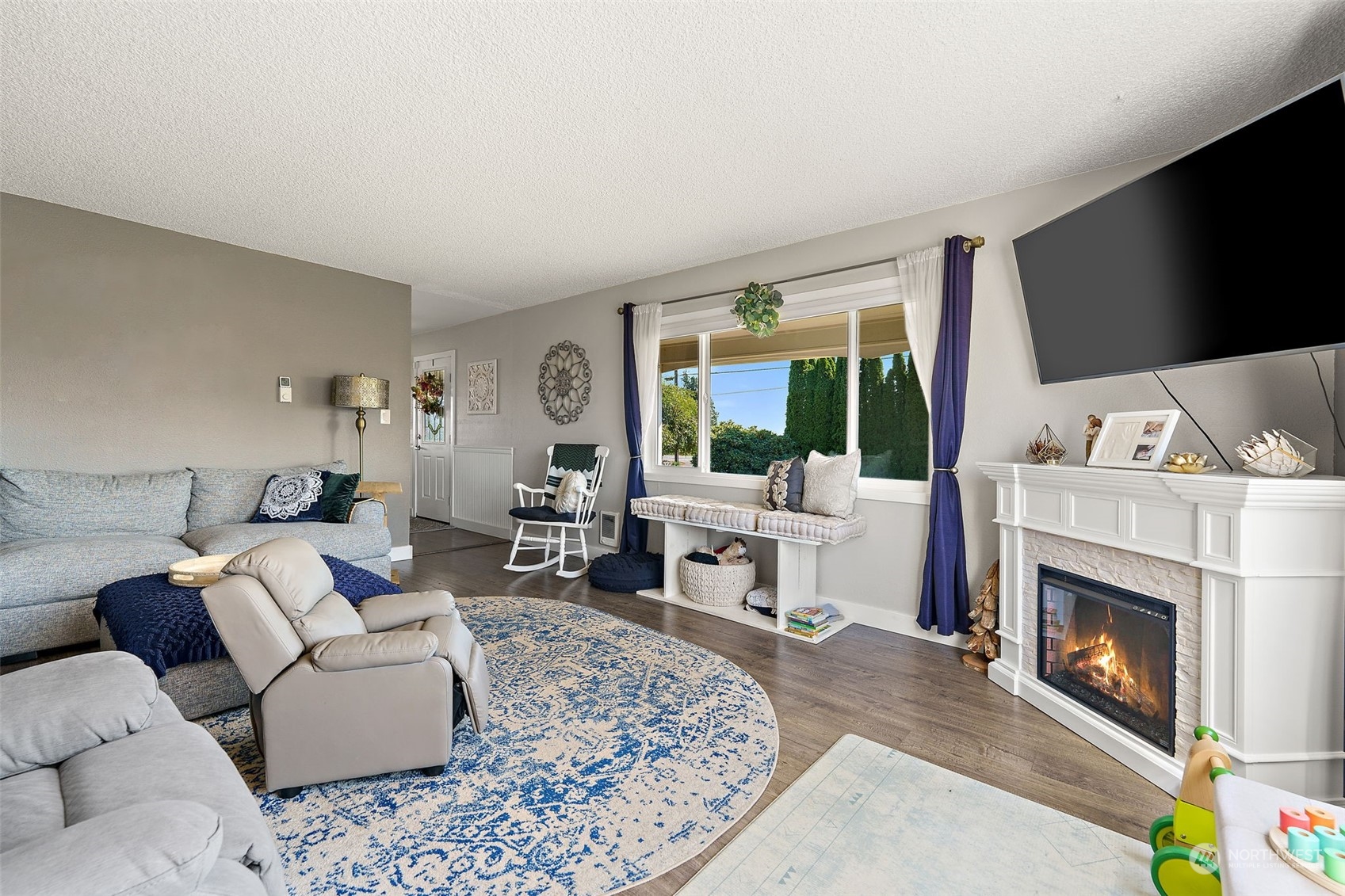 1880 Birch Bay Lynden Road Ferndale, WA 98248 - Photo 9 of 33 a living room with furniture a flat screen tv and a fireplace