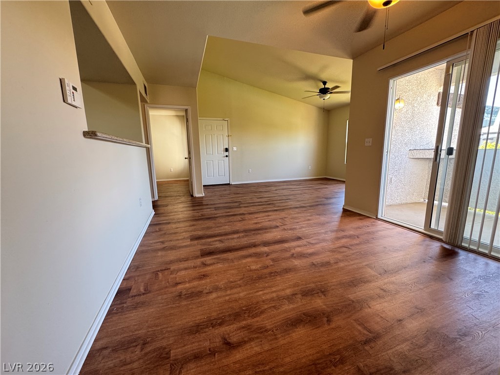 7255 West Sunset Road, Unit 2111 Las Vegas, NV 89113 - Photo 6 of 33 Rich hardwood-style flooring extends throughout this open living space with a private balcony.
