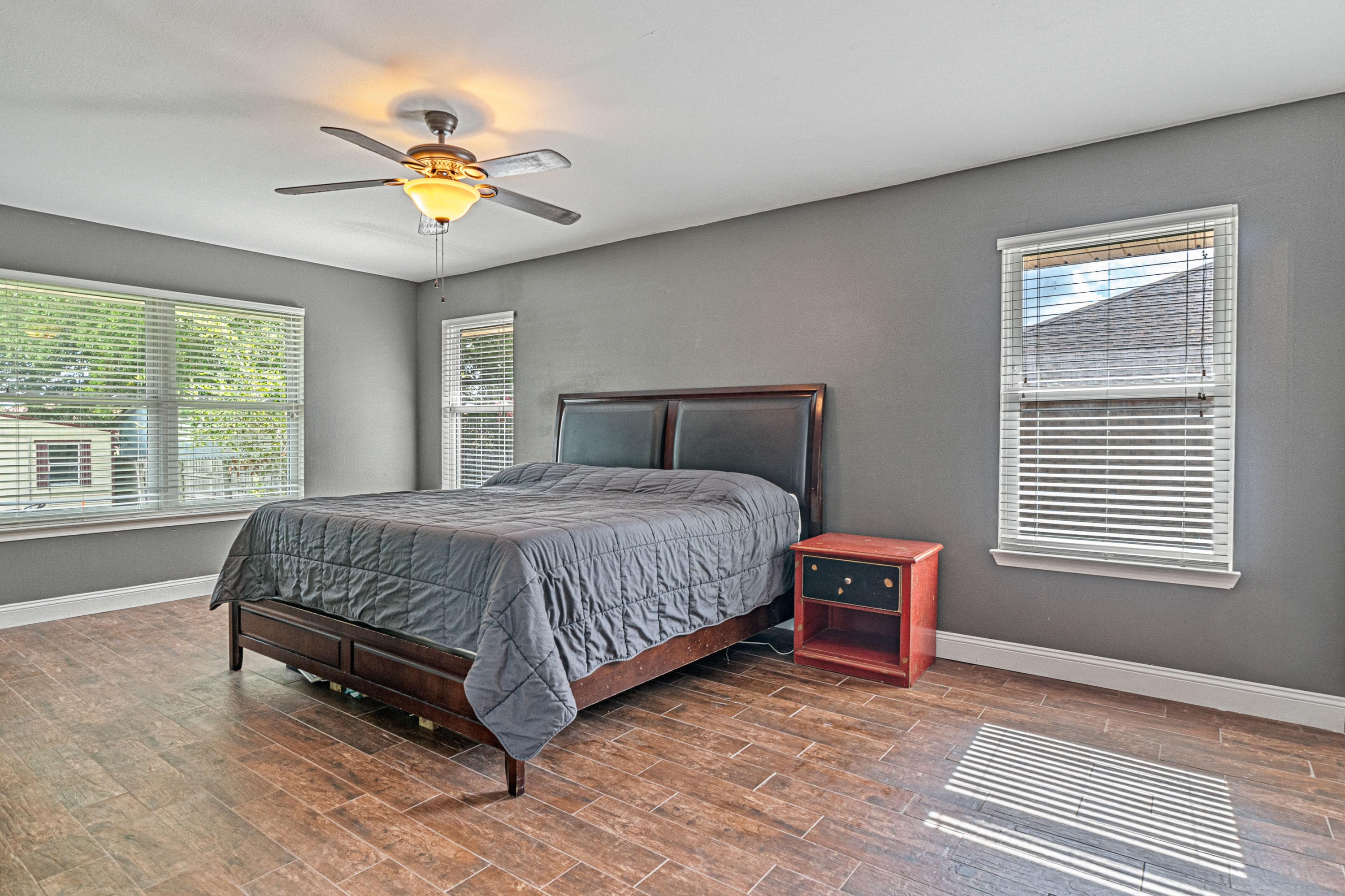 2813 Atoka Trail Crestview, FL 32539 - Photo 14 of 29 a bedroom with a bed and a chandelier