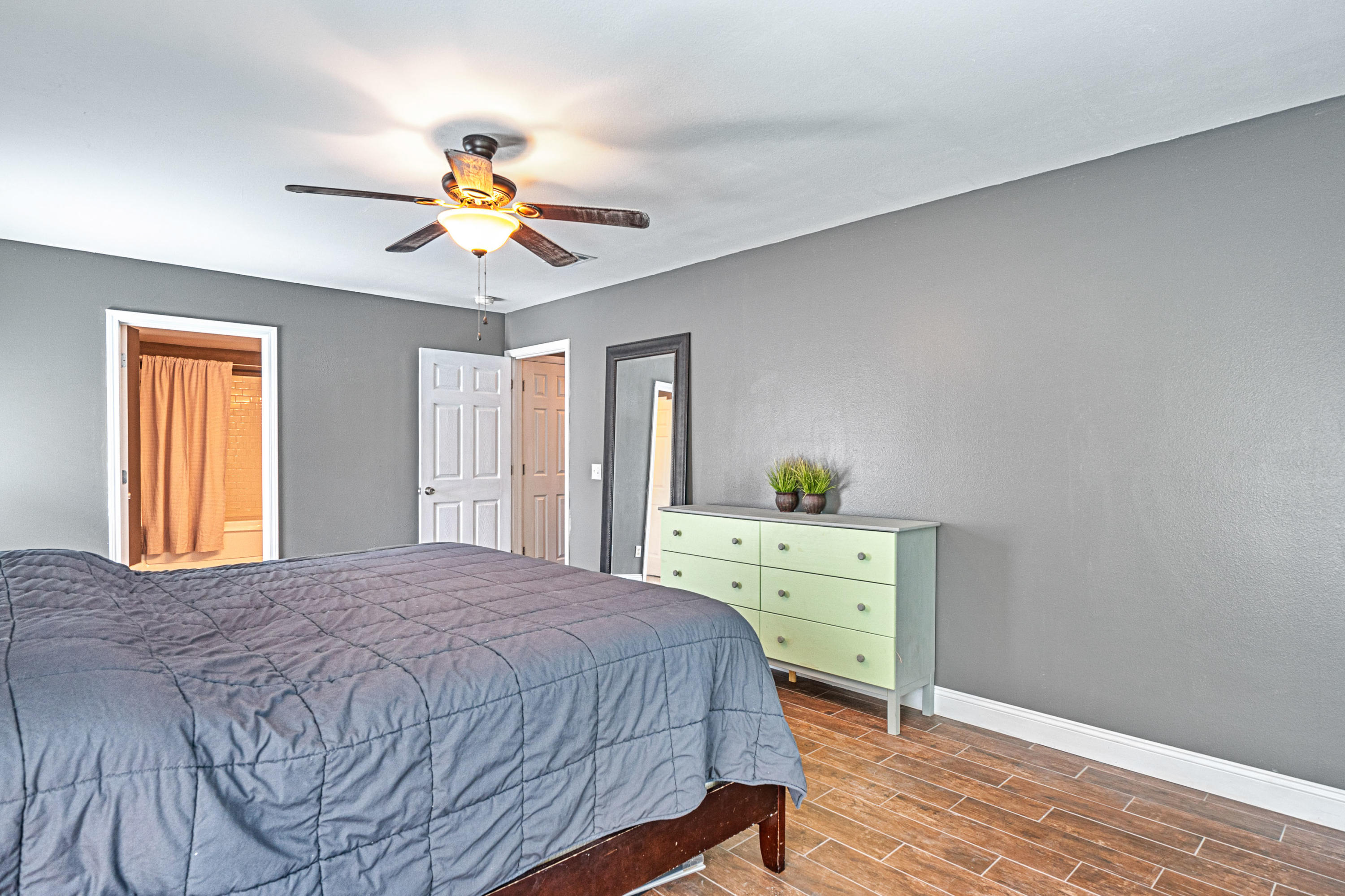 2813 Atoka Trail Crestview, FL 32539 - Photo 15 of 29 a bedroom with a bed and a dresser
