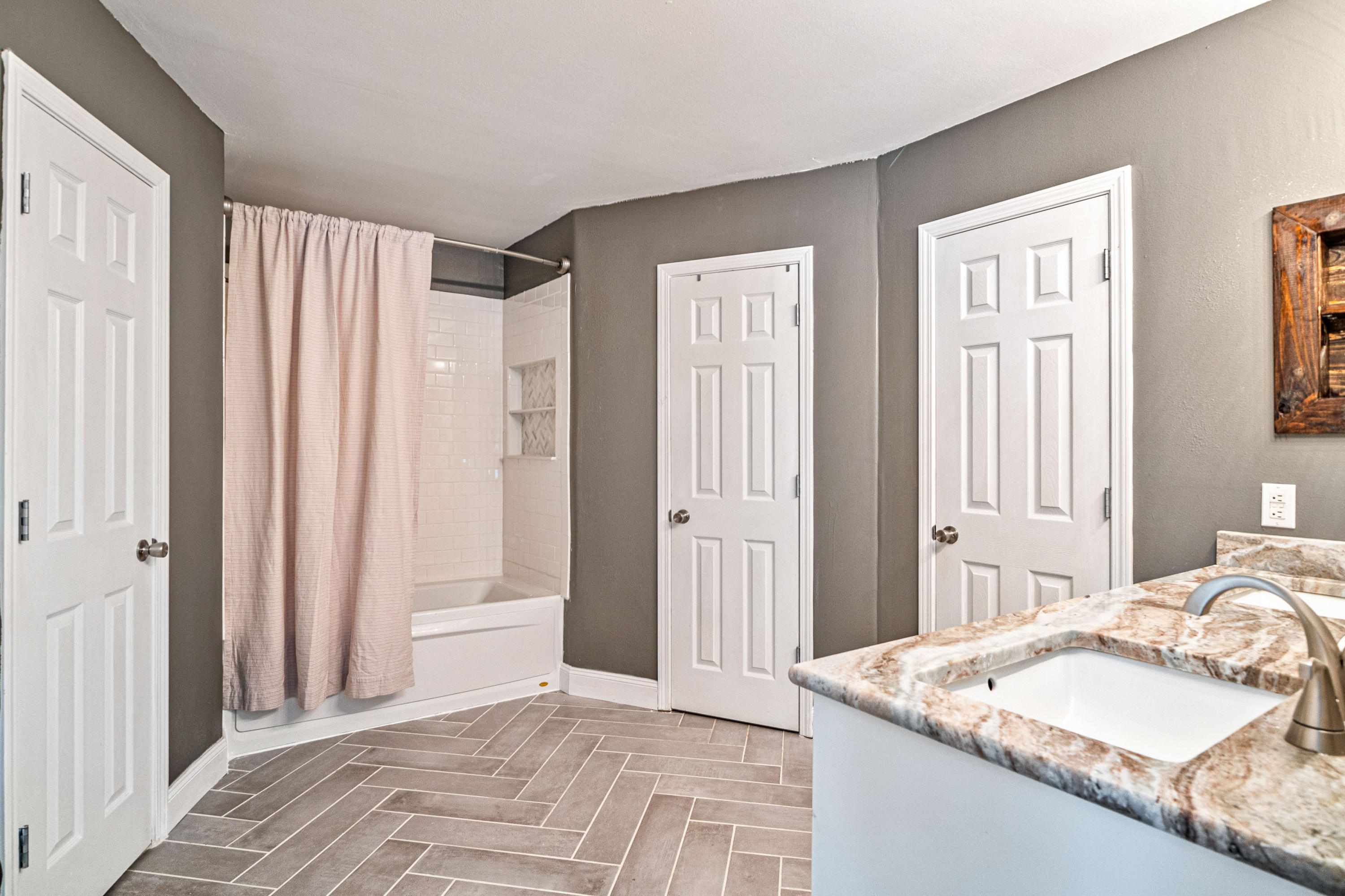 2813 Atoka Trail Crestview, FL 32539 - Photo 16 of 29 a bedroom with a granite countertop sink and a bed