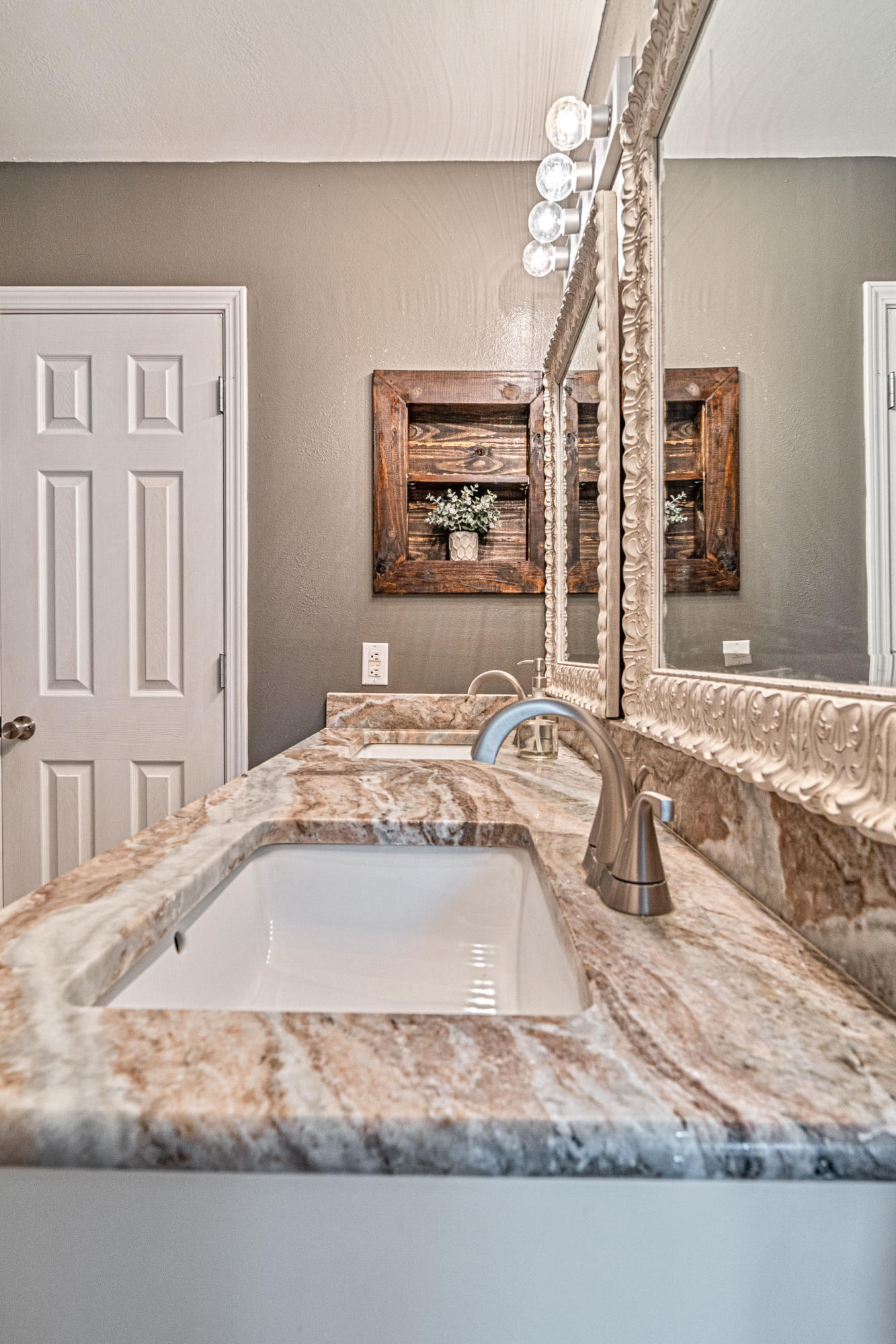 2813 Atoka Trail Crestview, FL 32539 - Photo 18 of 29 a bathroom with a granite countertop sink and a mirror
