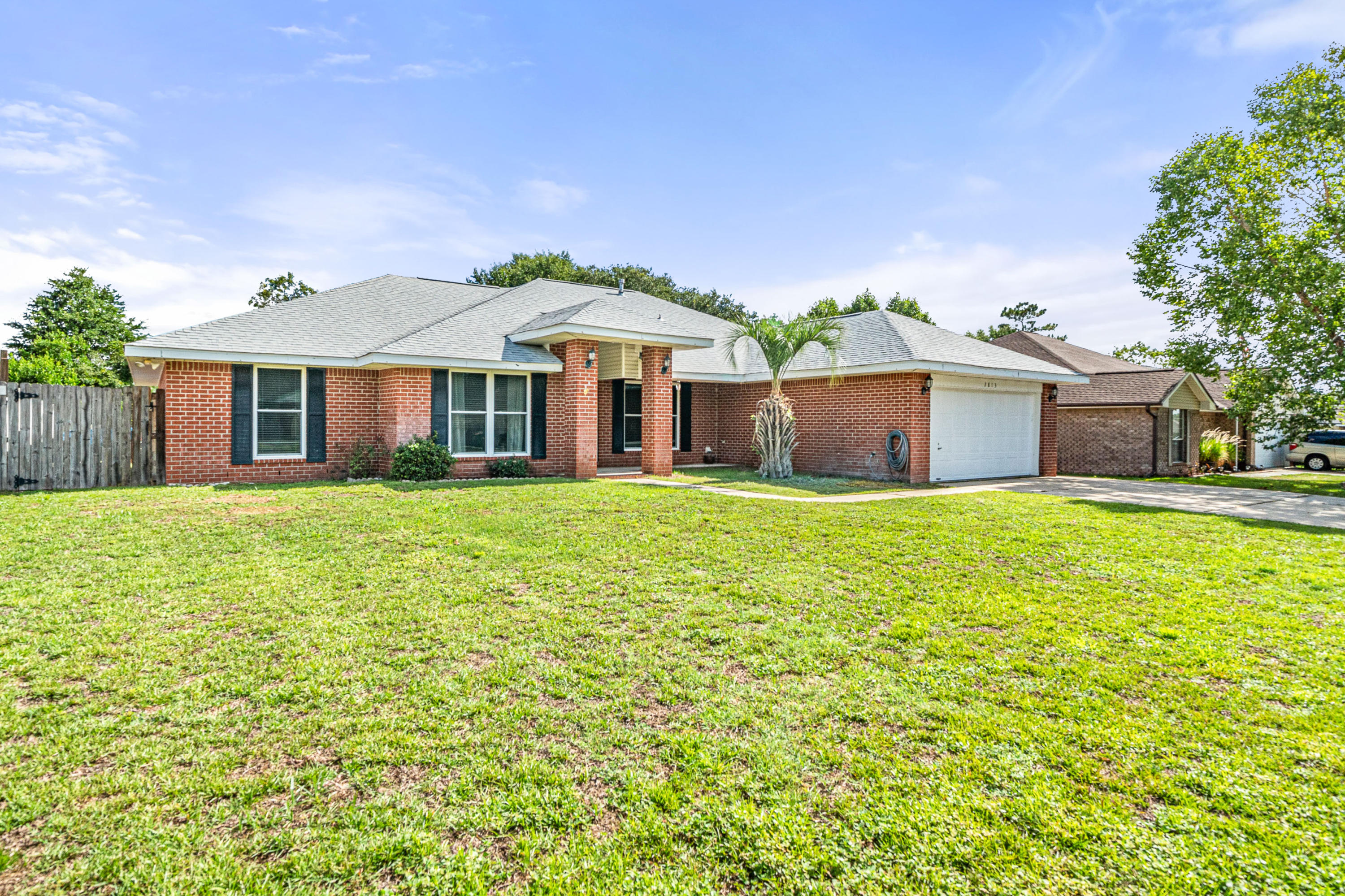 2813 Atoka Trail Crestview, FL 32539 - Photo 2 of 29 a front view of a house with a big yard