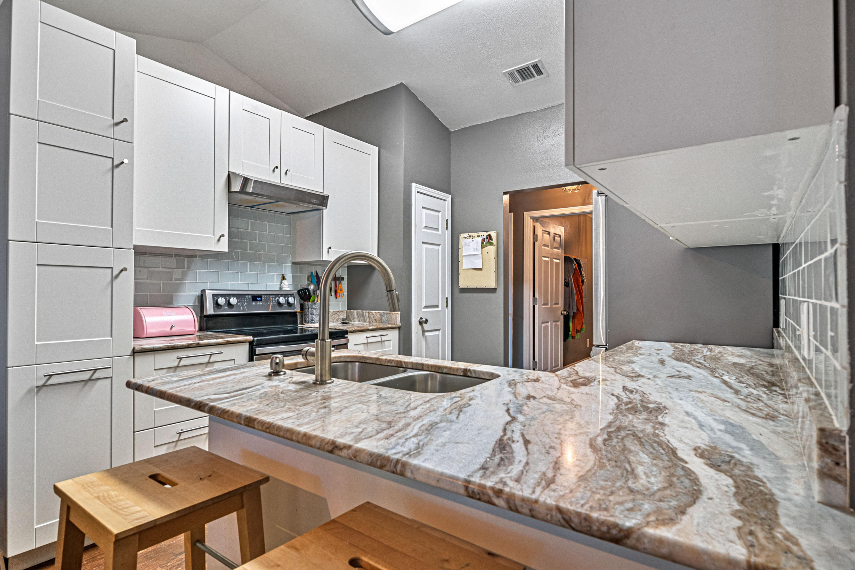 2813 Atoka Trail Crestview, FL 32539 - Photo 22 of 29 a kitchen with stainless steel appliances granite countertop a sink refrigerator and cabinets