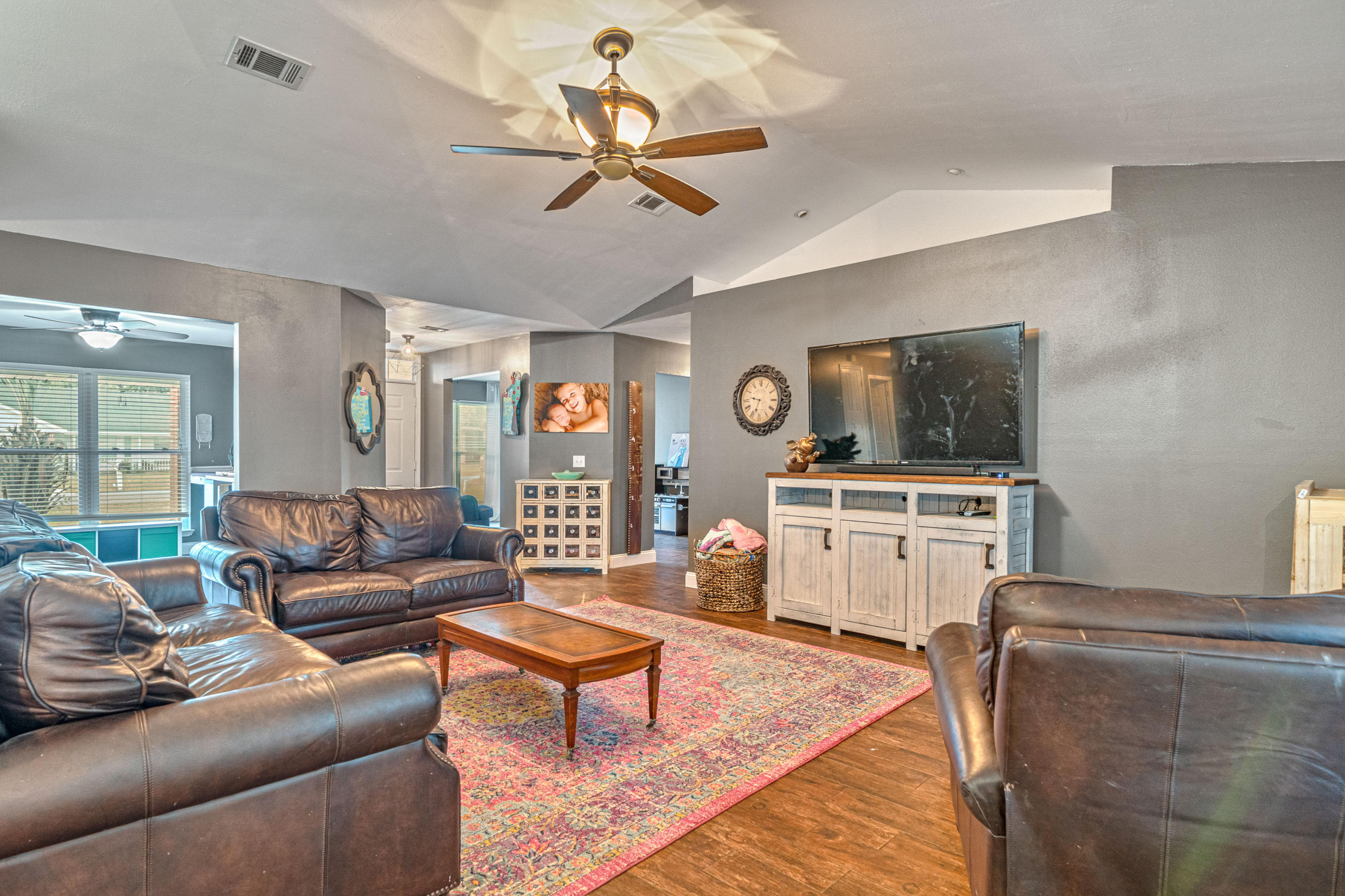 2813 Atoka Trail Crestview, FL 32539 - Photo 24 of 29 a living room with furniture and a flat screen tv