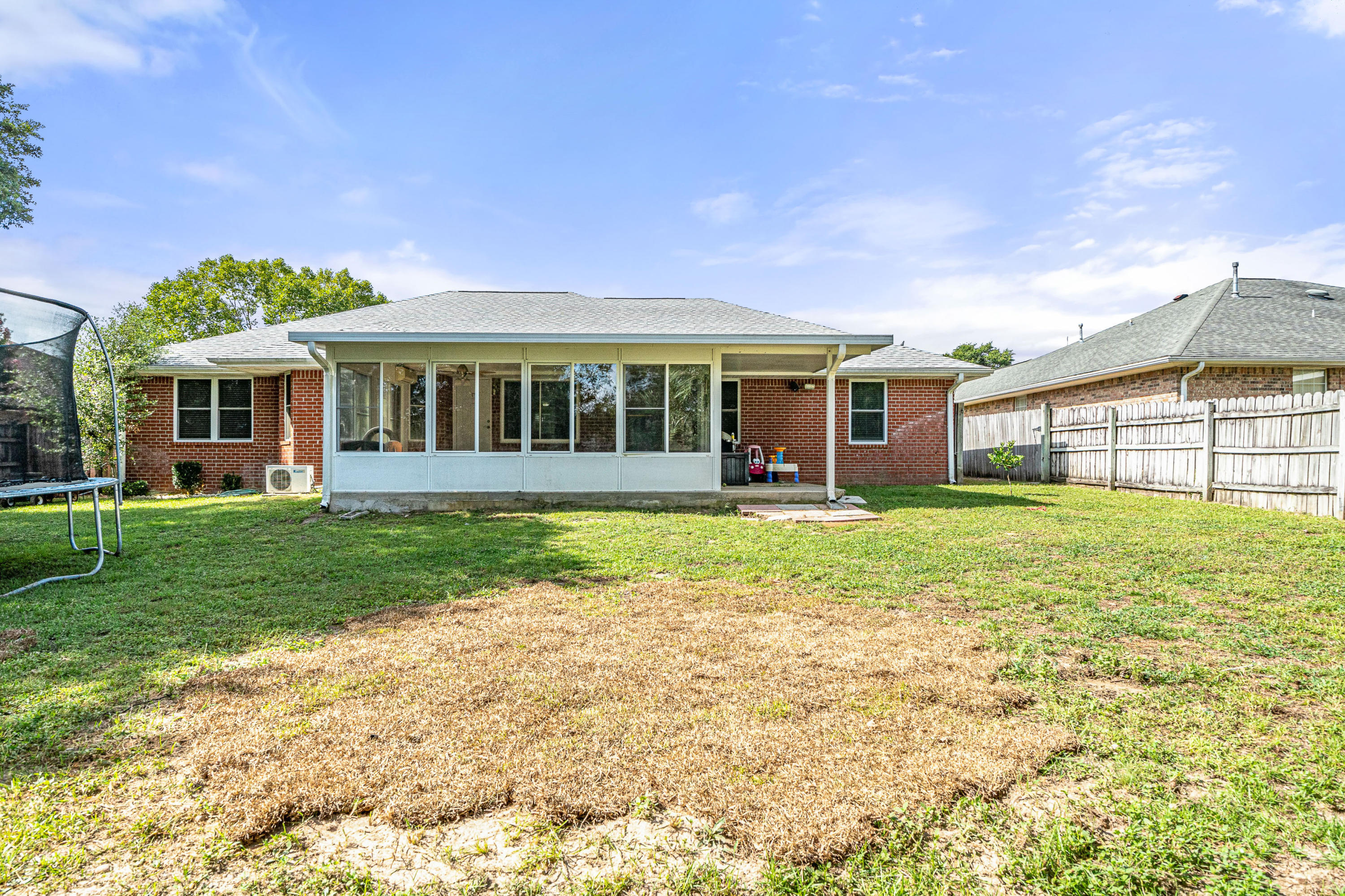 2813 Atoka Trail Crestview, FL 32539 - Photo 29 of 29 a view of a house with a backyard