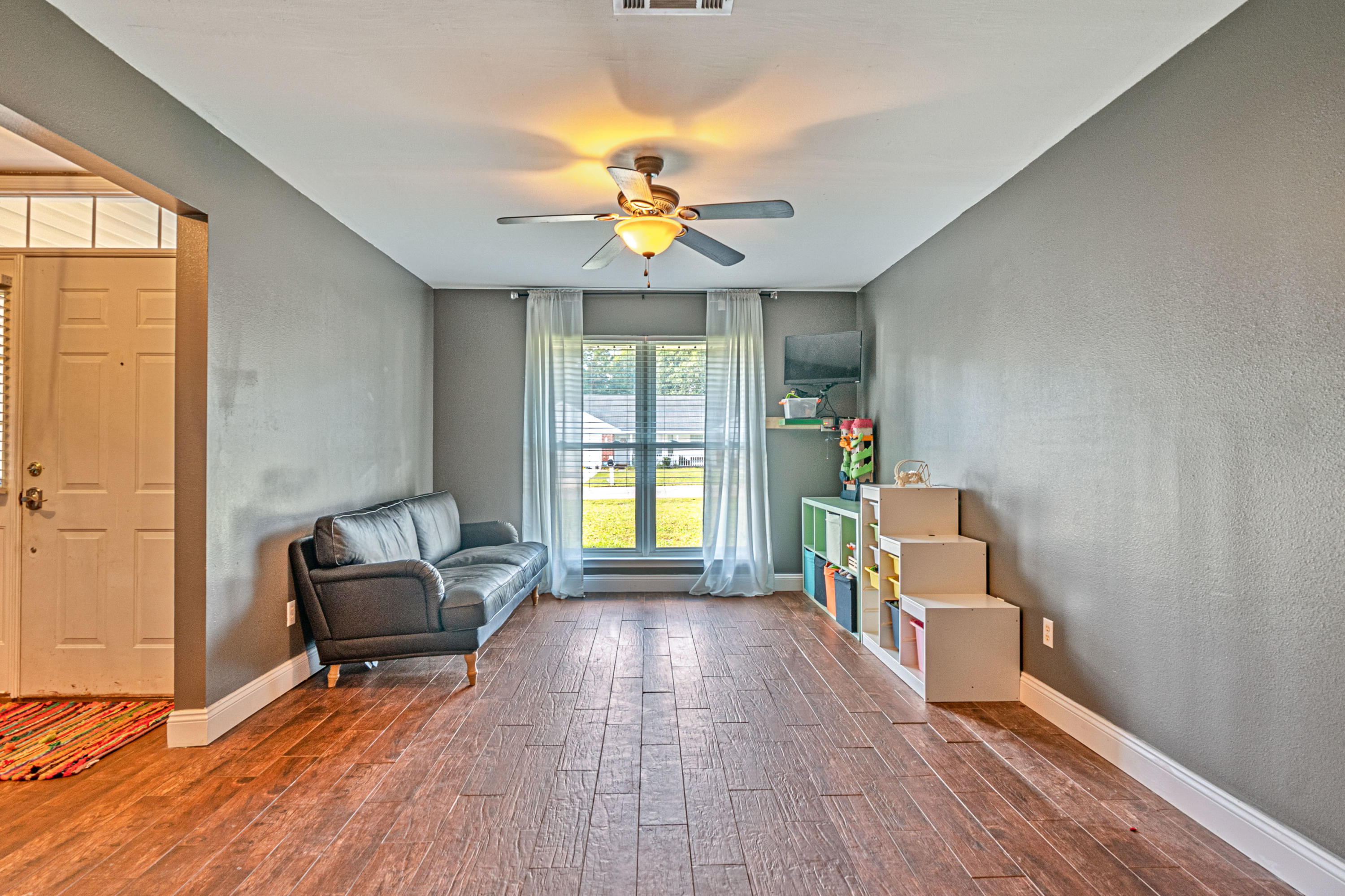 2813 Atoka Trail Crestview, FL 32539 - Photo 4 of 29 a living room with furniture and a fireplace