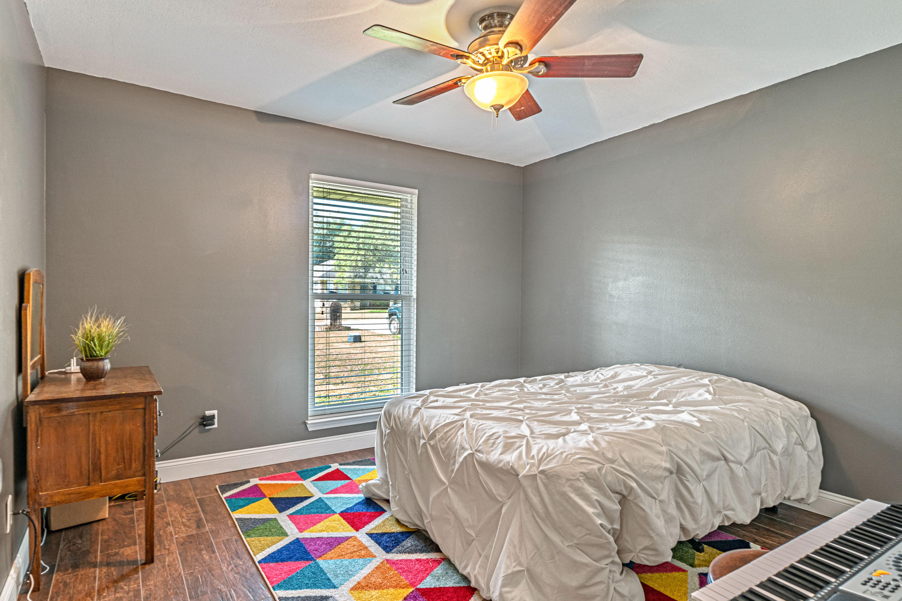 2813 Atoka Trail Crestview, FL 32539 - Photo 7 of 29 a bedroom with a bed and a window