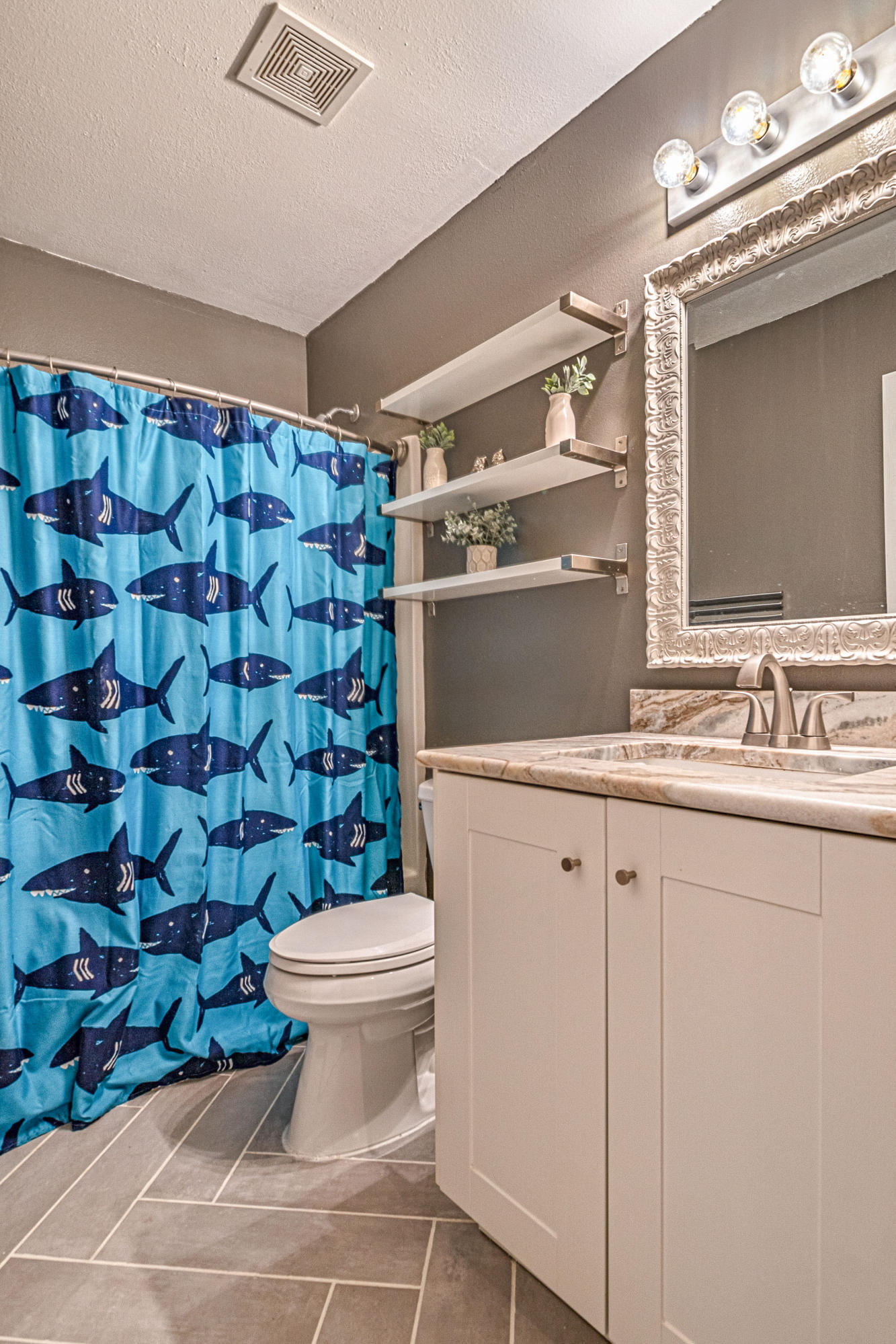 2813 Atoka Trail Crestview, FL 32539 - Photo 9 of 29 a bathroom with a sink toilet and shower