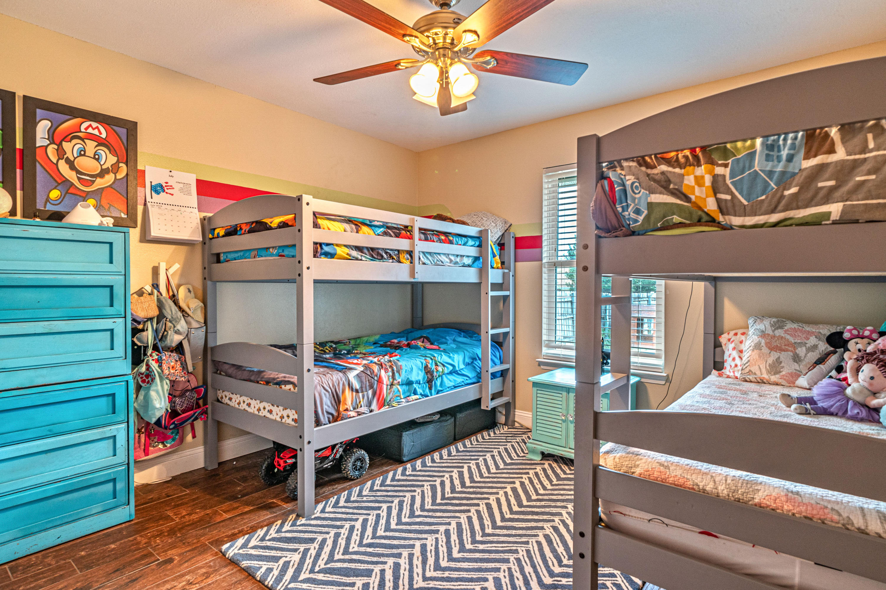 2813 Atoka Trail Crestview, FL 32539 - Photo 10 of 29 a bedroom with a bed and wooden floor