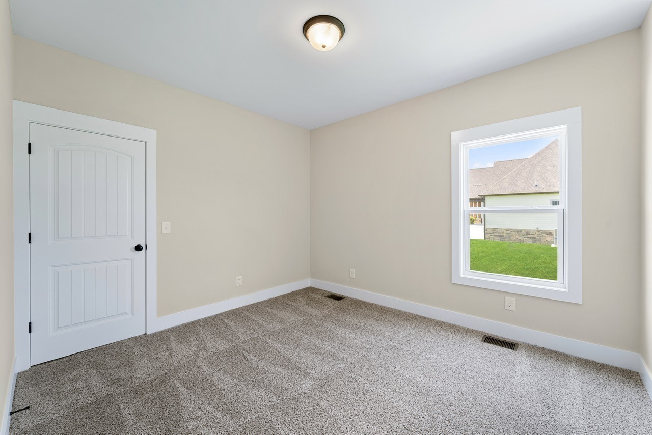 541 Clearview Road Cottontown, TN 37048 - Photo 12 of 18 an empty room with windows
