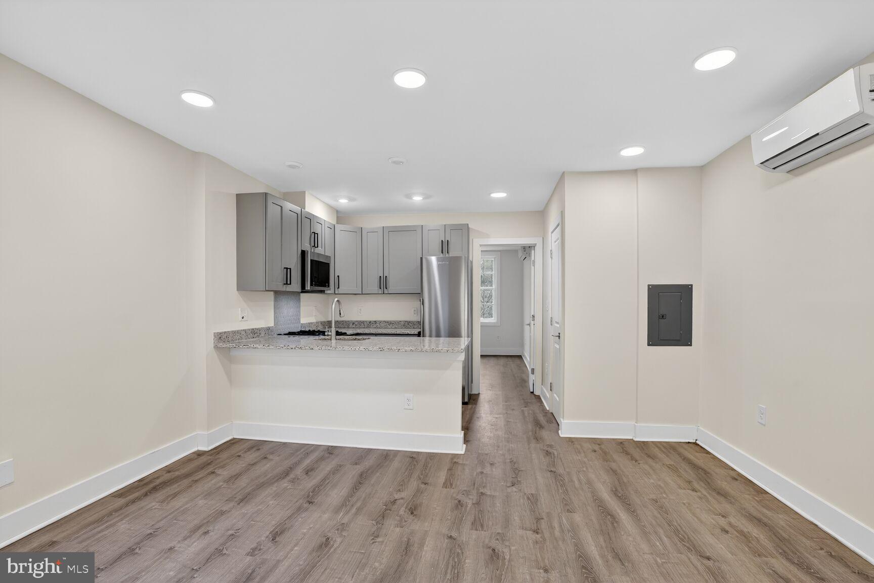 1821 T Street Northwest Washington, DC 20009 - Photo 26 of 40 a view of a kitchen with a sink and a refrigerator