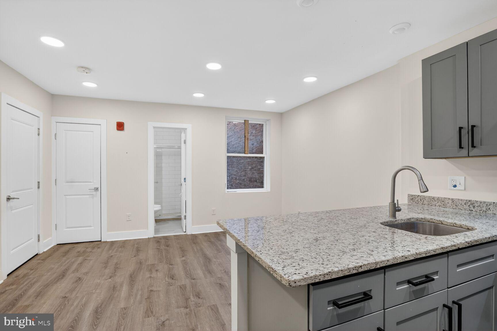 1821 T Street Northwest Washington, DC 20009 - Photo 32 of 40 a kitchen with sink and mirror