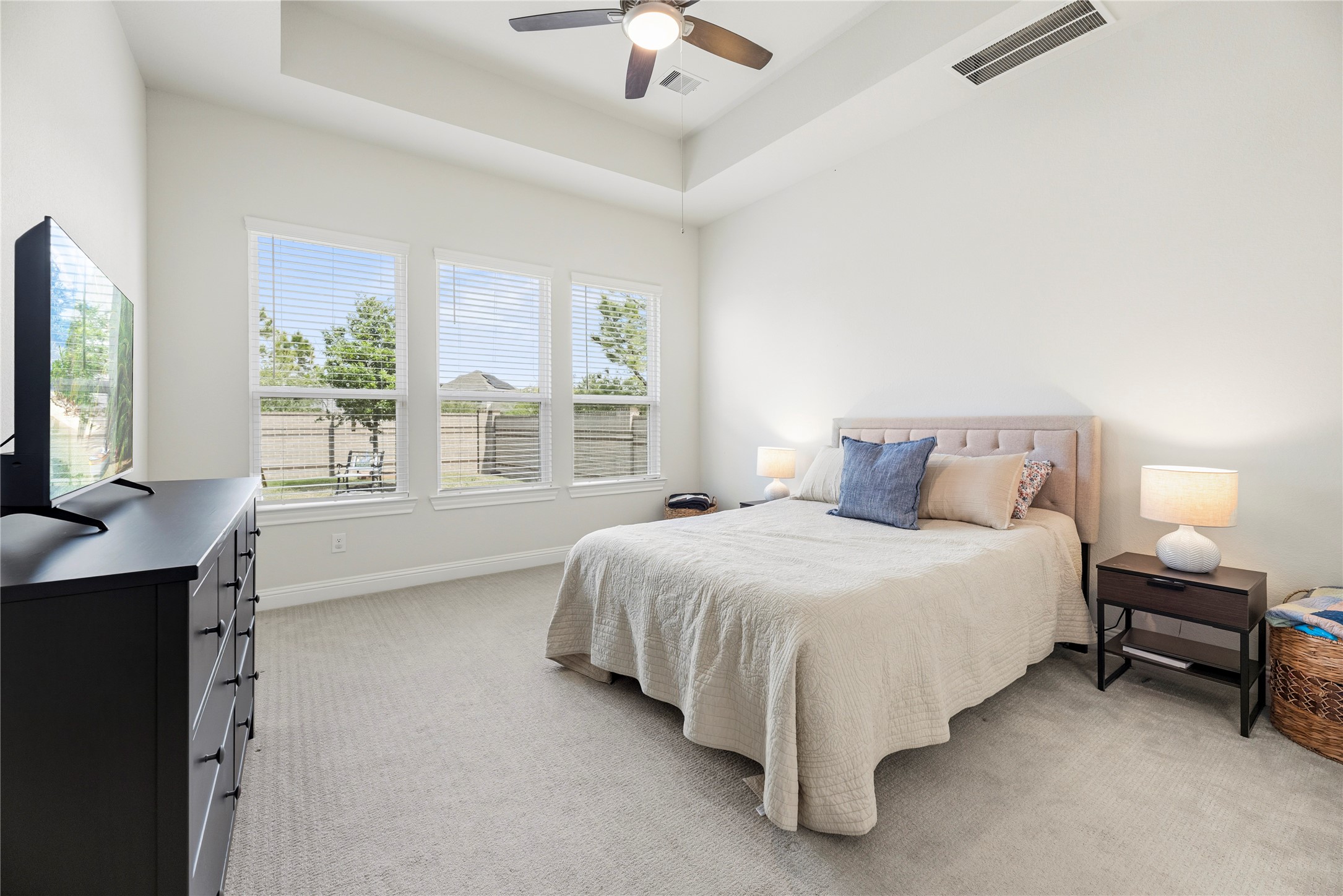 10702 Port Harrison Road Cypress, TX 77433 - Photo 19 of 44 Great sized primary bedroom with tray cileing and double French doors that take you into the tranquil en suite bath.