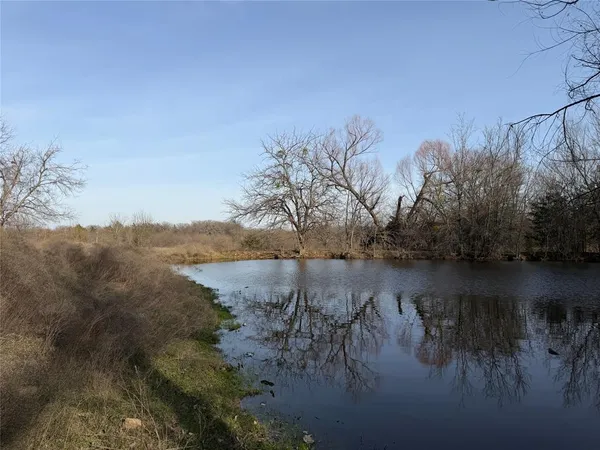 a view of lake with green space