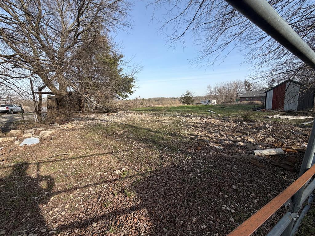 194 Middle Road Denison, TX 75021 - Photo 4 of 9 a view of a yard with wooden fence