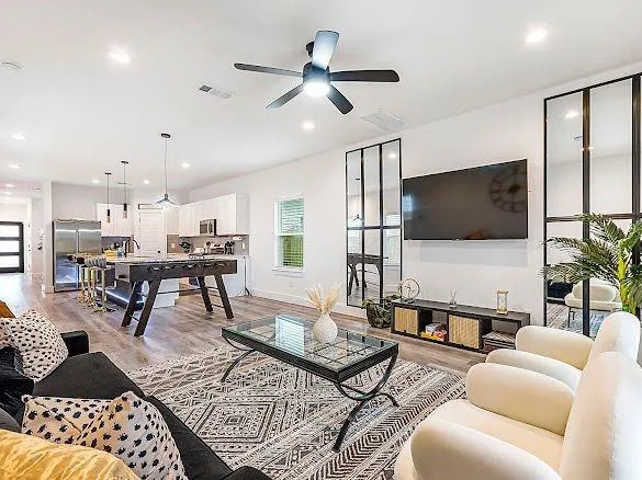 a living room with furniture and a flat screen tv