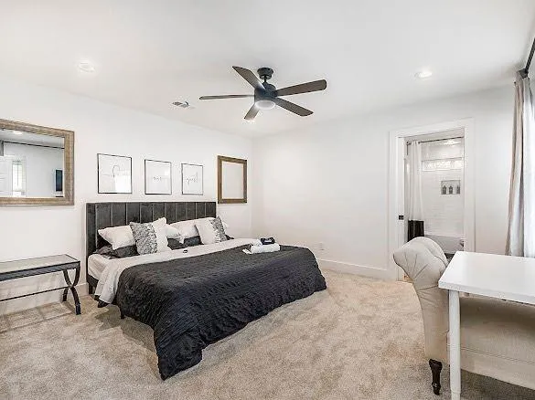 a bedroom with a bed and window