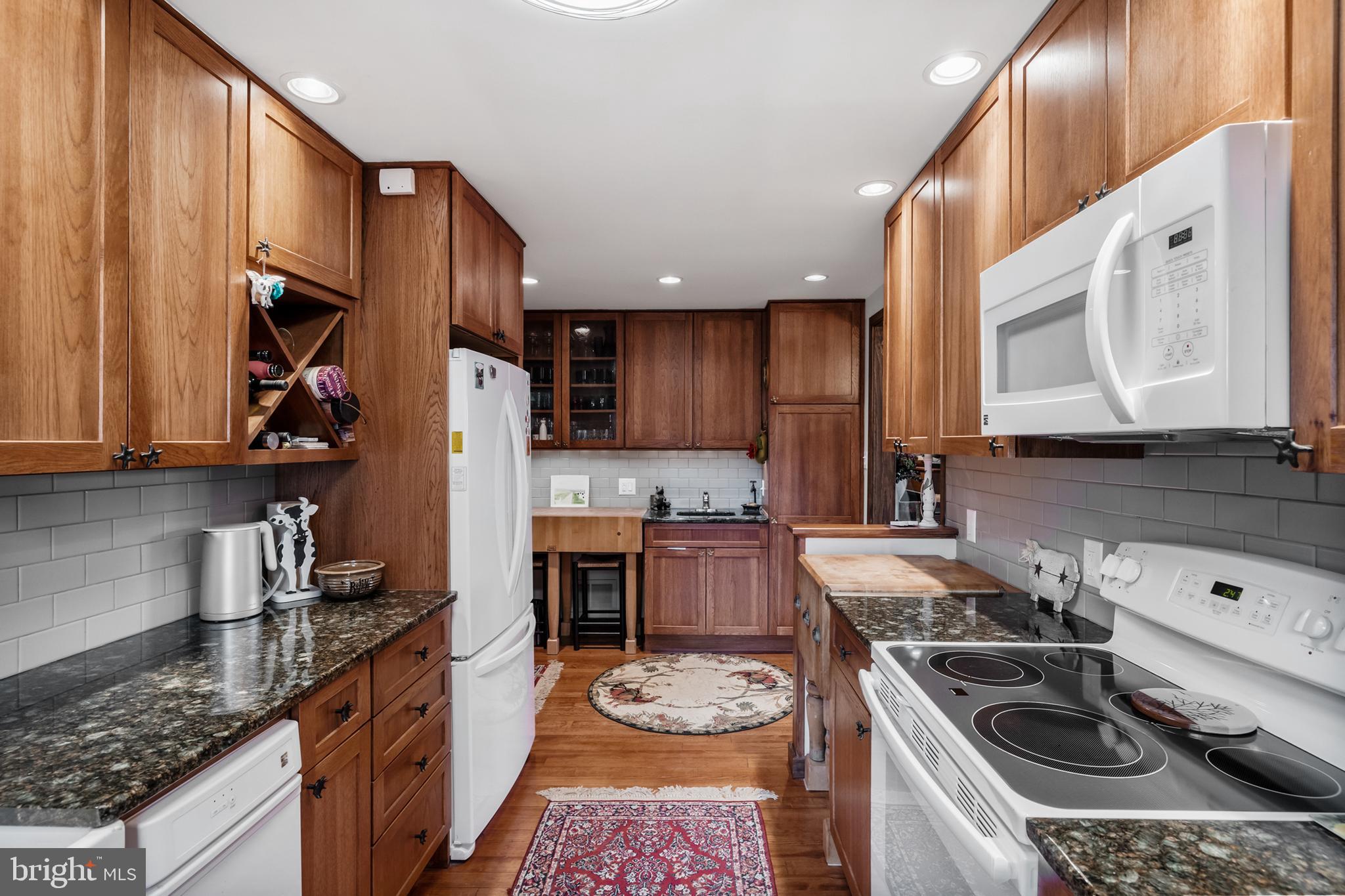 444 Shady Lane Moorestown, NJ 08057 - Photo 17 of 46 a kitchen with a sink stove and cabinets