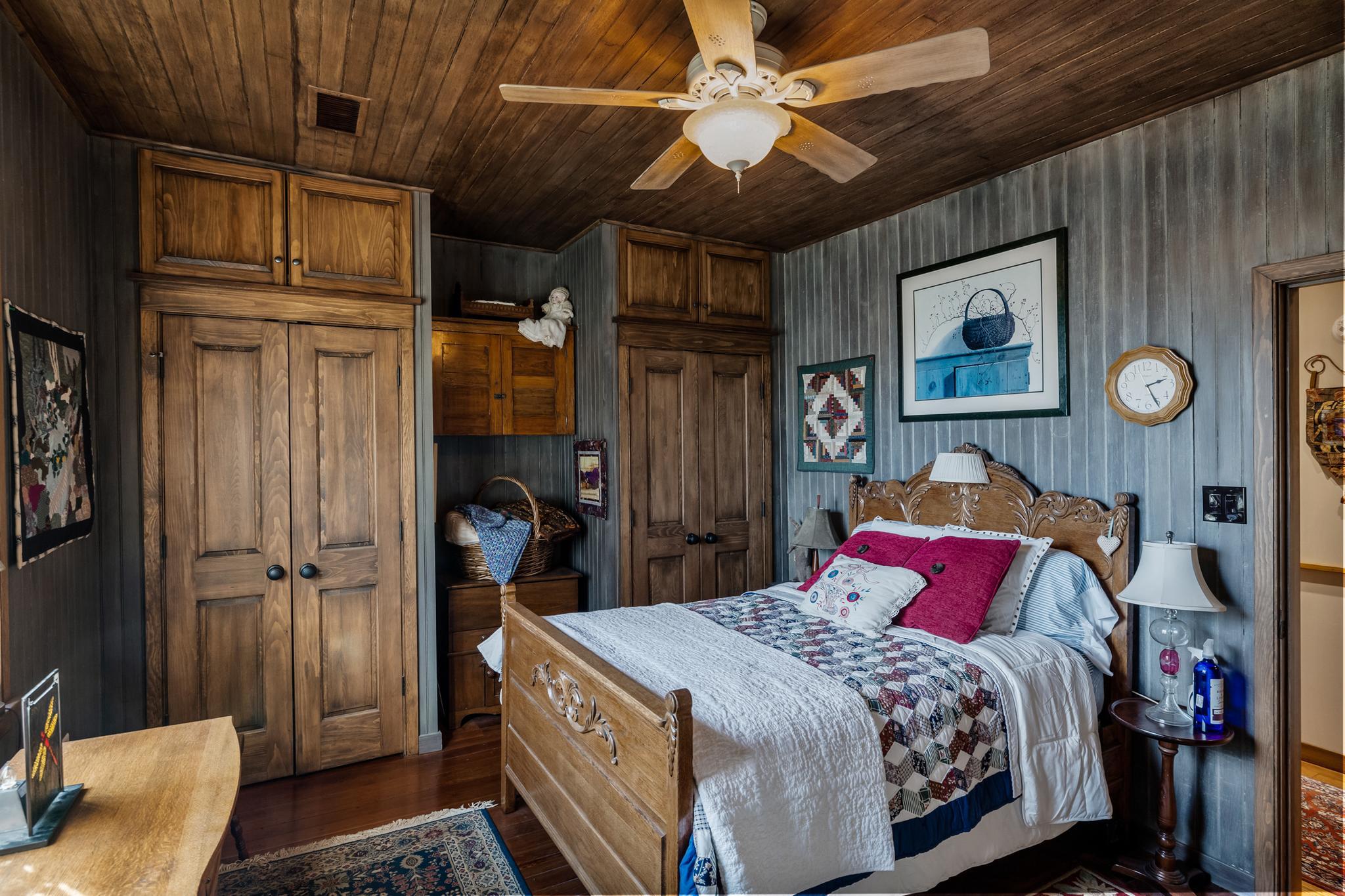 444 Shady Lane Moorestown, NJ 08057 - Photo 23 of 46 a bedroom with a bed and a chandelier