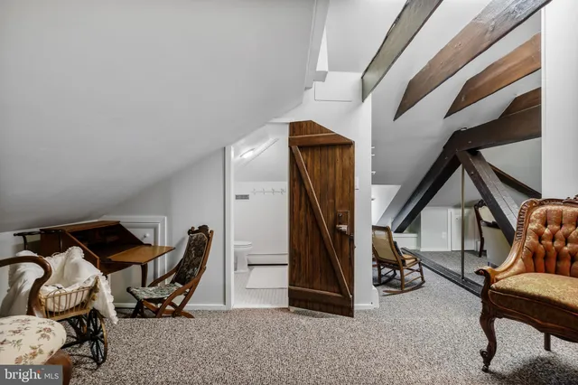 a view of an entryway with workspace and windows