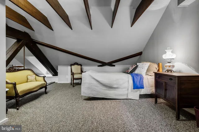 a bedroom with bed and window