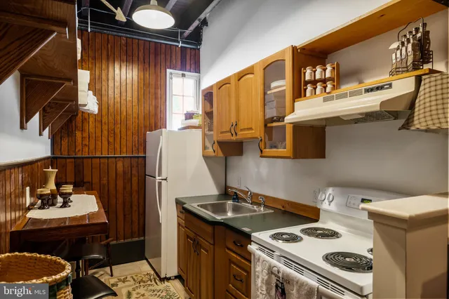 a kitchen with a stove and a sink