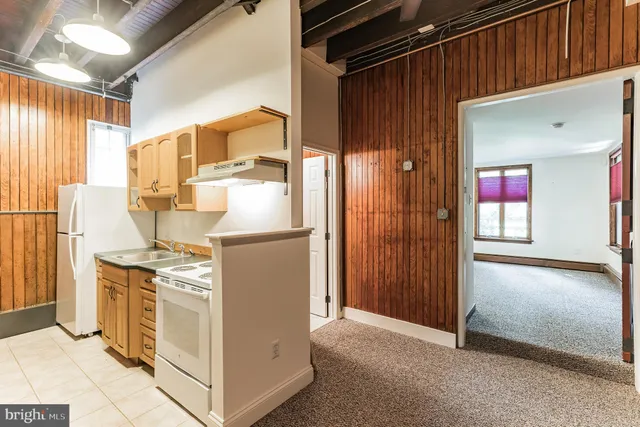 a view of a kitchen with appliances and cabinets