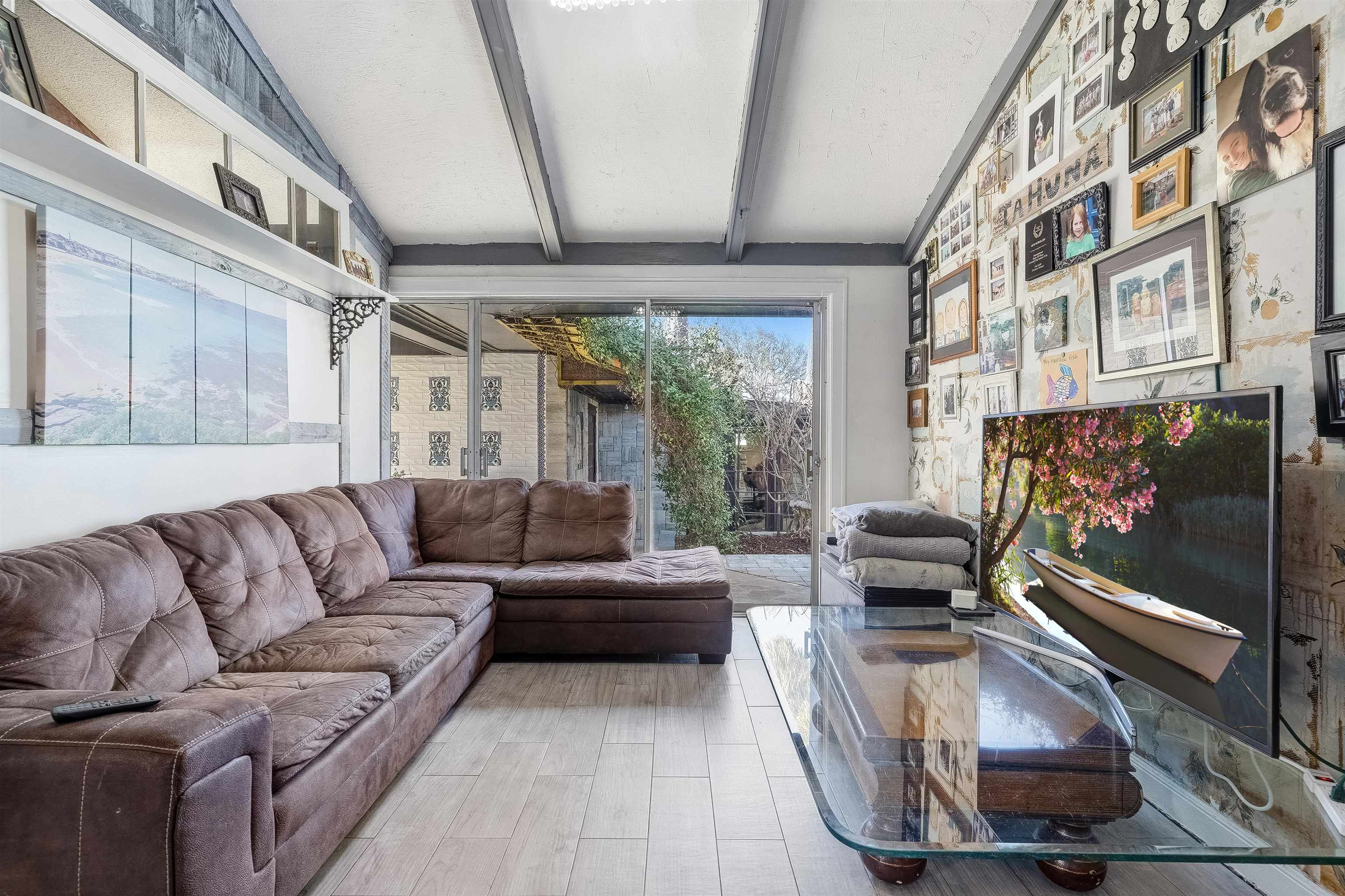 71 Water Street St. Augustine, FL 32084 - Photo 13 of 57 a living room with furniture and a flat screen tv