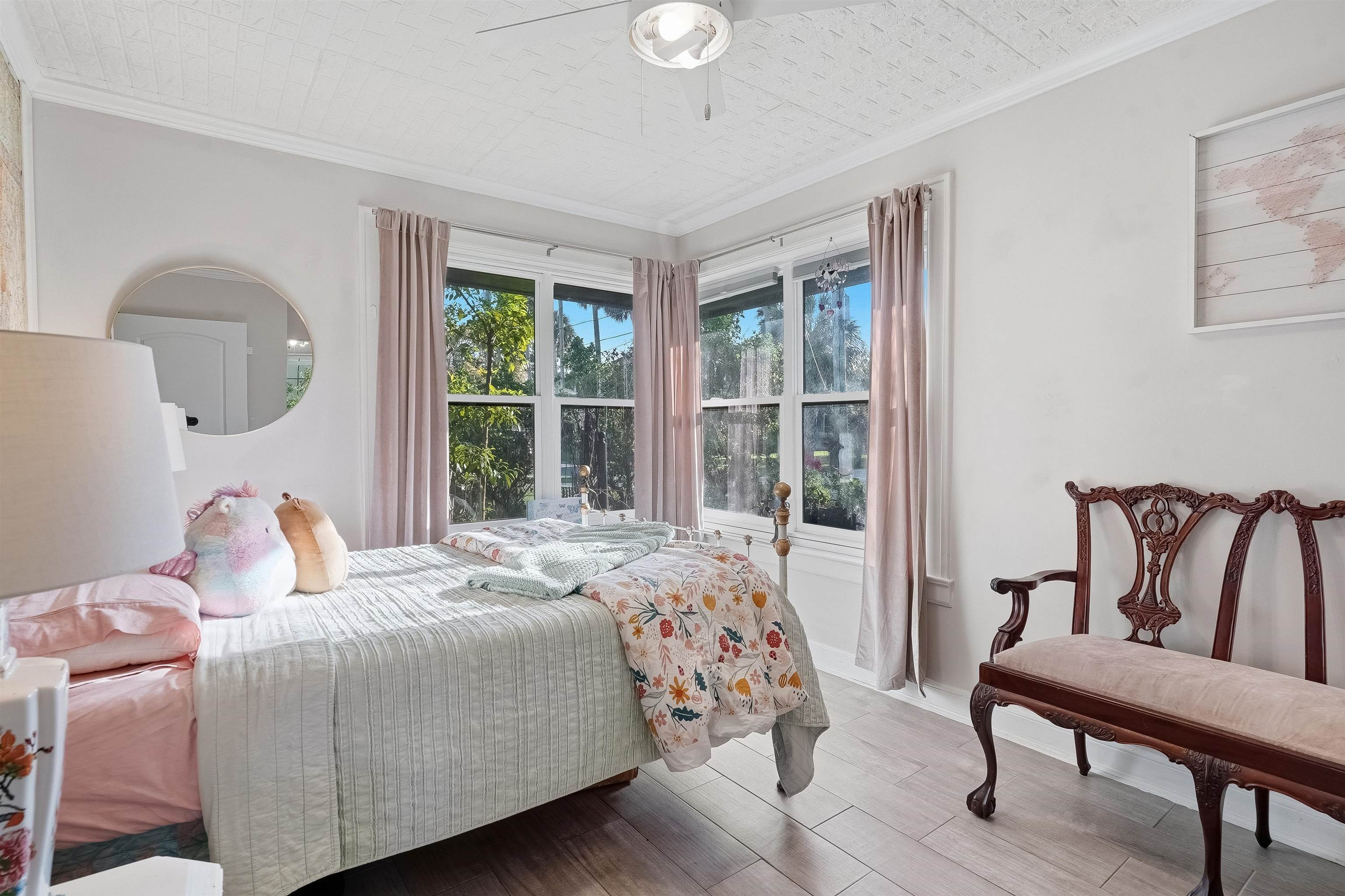 71 Water Street St. Augustine, FL 32084 - Photo 21 of 57 a bedroom with a bed and a window